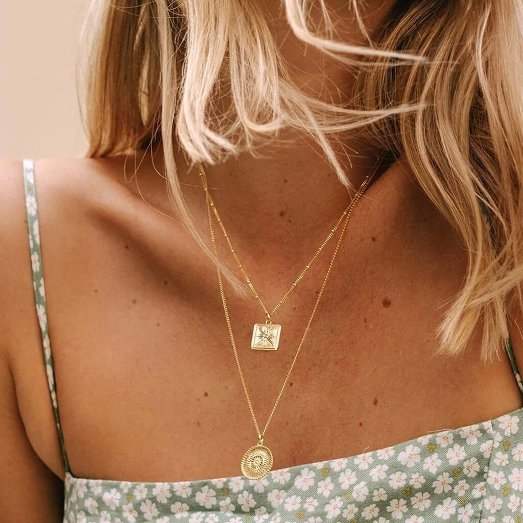Alt Tag: Kirstin Ash Bespoke Collection True North Coin Charm layered necklace in 18k gold vermeil, worn on model with square pendant