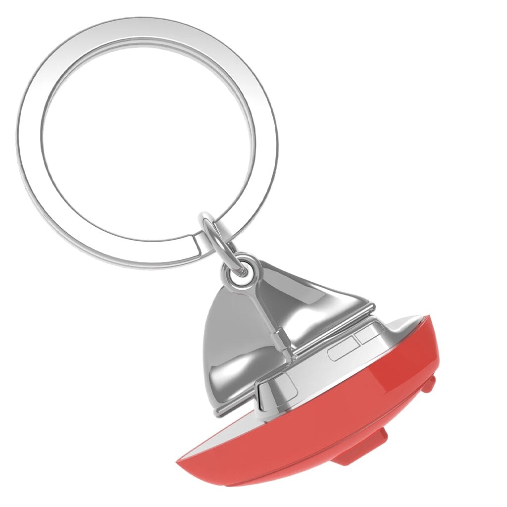 Red sailboat keychain on a white background