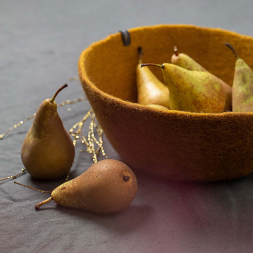Muskhane Felt Bowl - Gold handmade fairtrade felt storage bowl holding pears