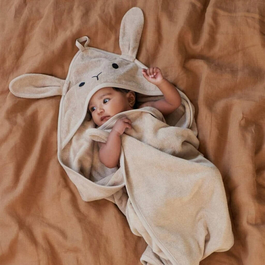 Alt Tag: Nature Baby Organic Cotton Bunny Hooded Towel - Nougat on baby, ultra-soft GOTS organic cotton terry hooded towel with bunny ears
