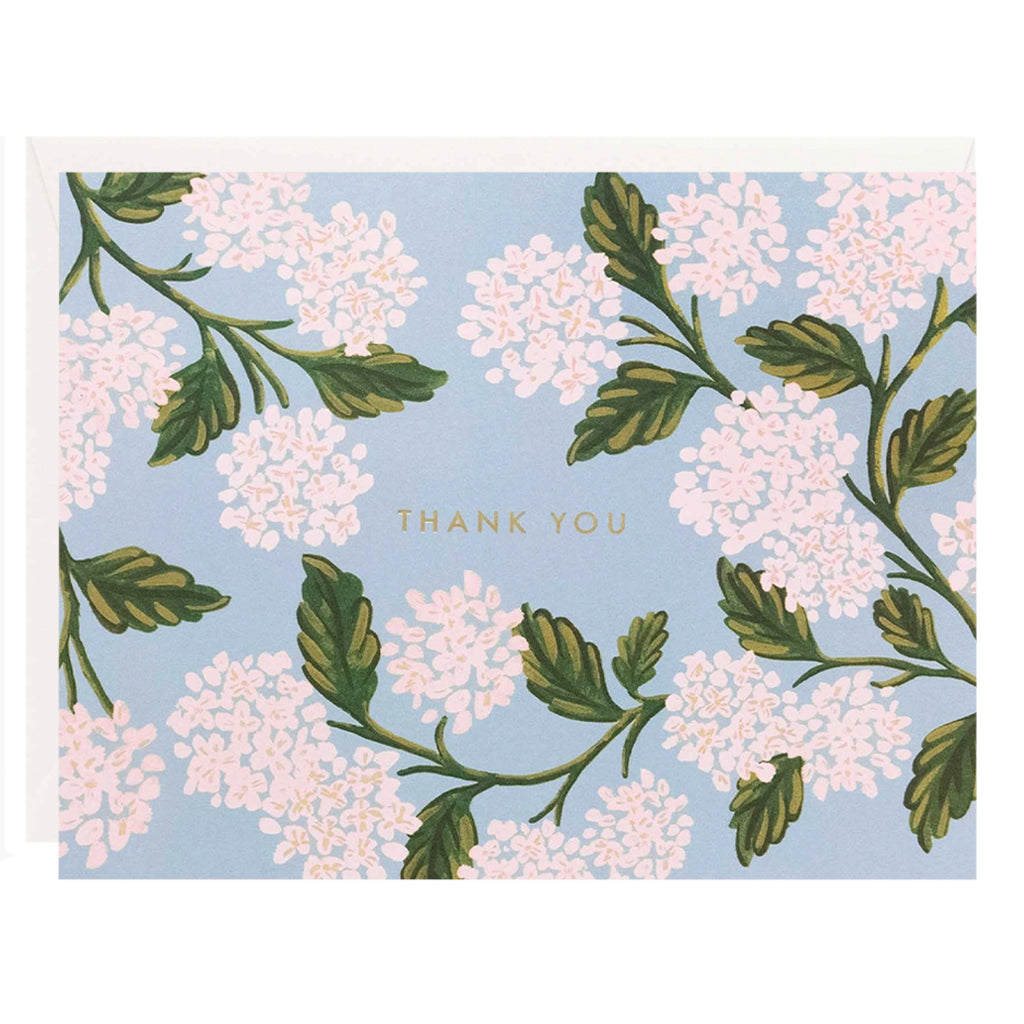 A thank you card with a floral pattern and the text 'THANK YOU' centered at the bottom. The card is primarily white with gold foil details and green leaves.