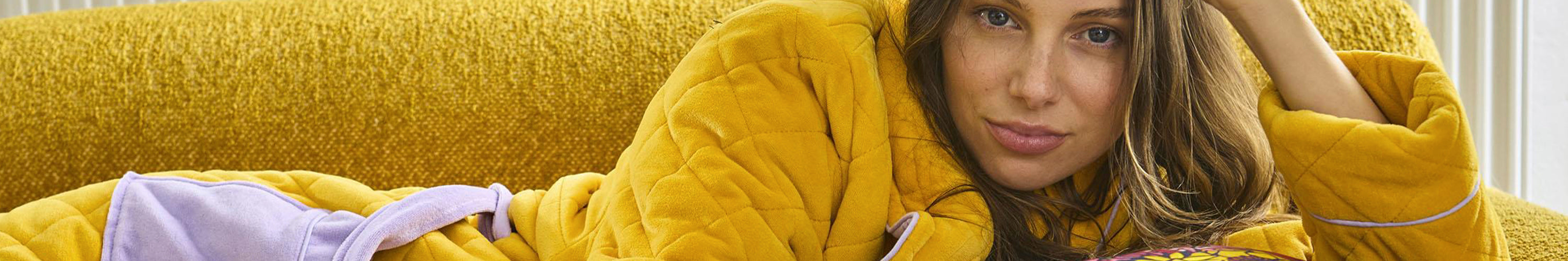 Kip & Co colourful floral cushion and bedding close-up, vibrant patterned quilt cover fabric and statement cushions for fun home styling