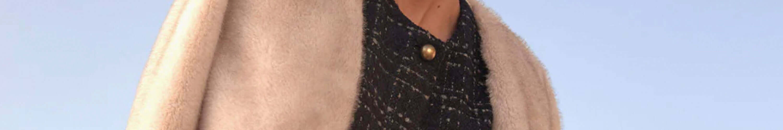 Alt Tag: Zoe Kratzmann black textured top with gold button detail and beige outer layer, effortless modern femininity fashion