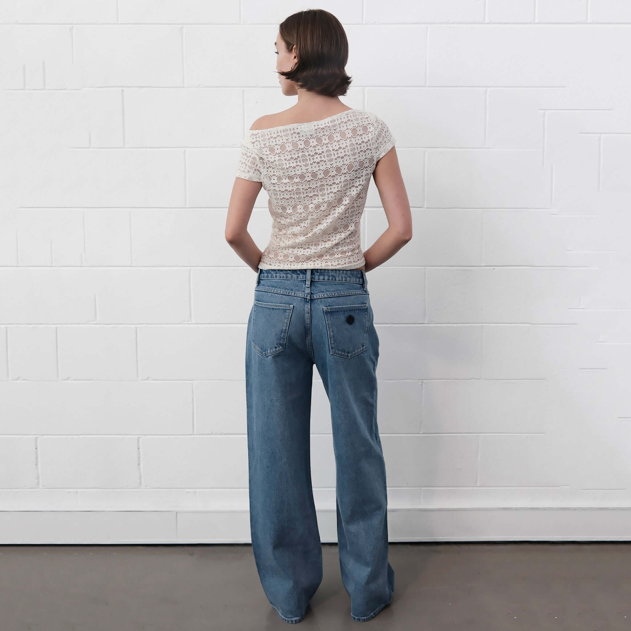 Alt Tag: Abrand 95 Mid Baggy Jeans - Selena bright blue vintage stonewash mid-rise wide-leg denim, back view fit