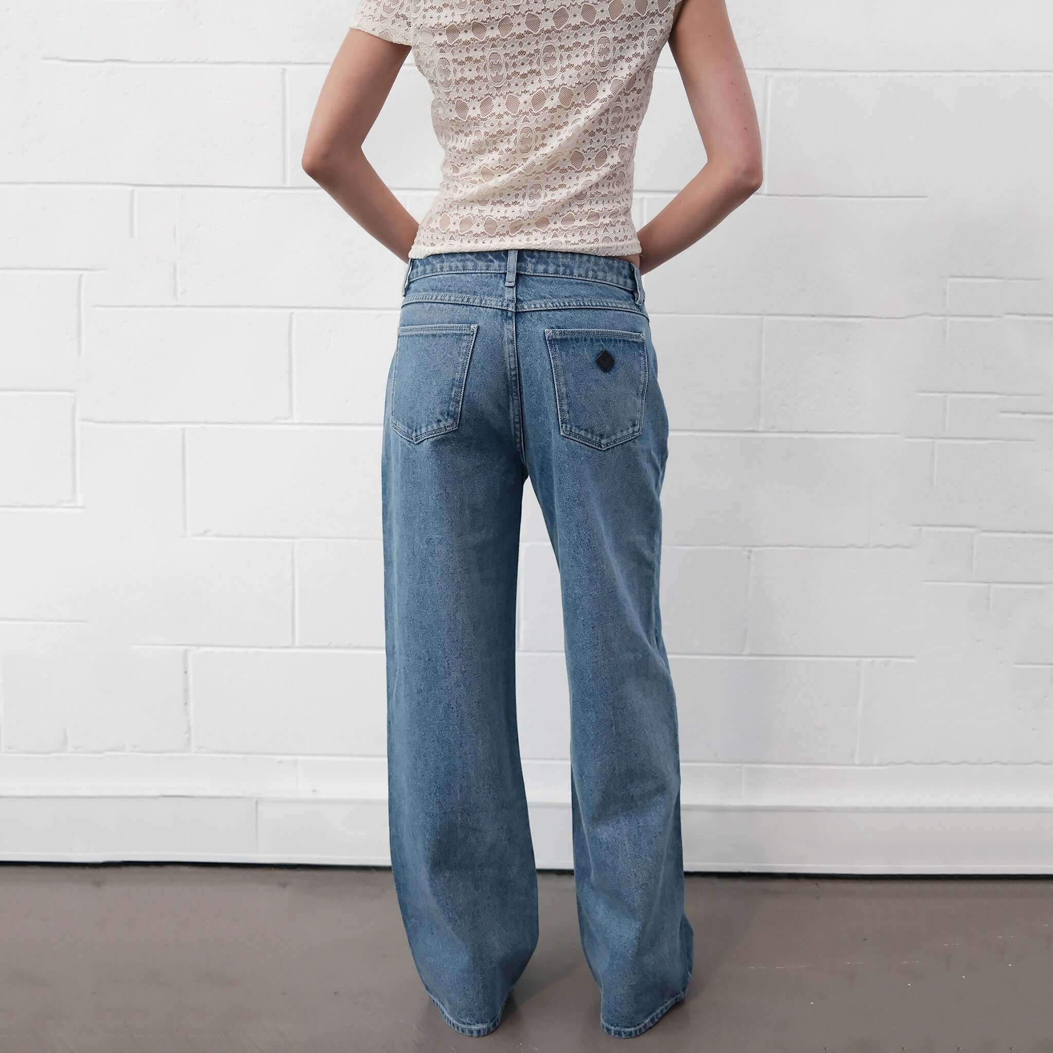 Alt Tag: Abrand 95 Mid Baggy Jeans - Selena bright blue vintage stonewash mid-rise wide leg baggy denim jeans back view