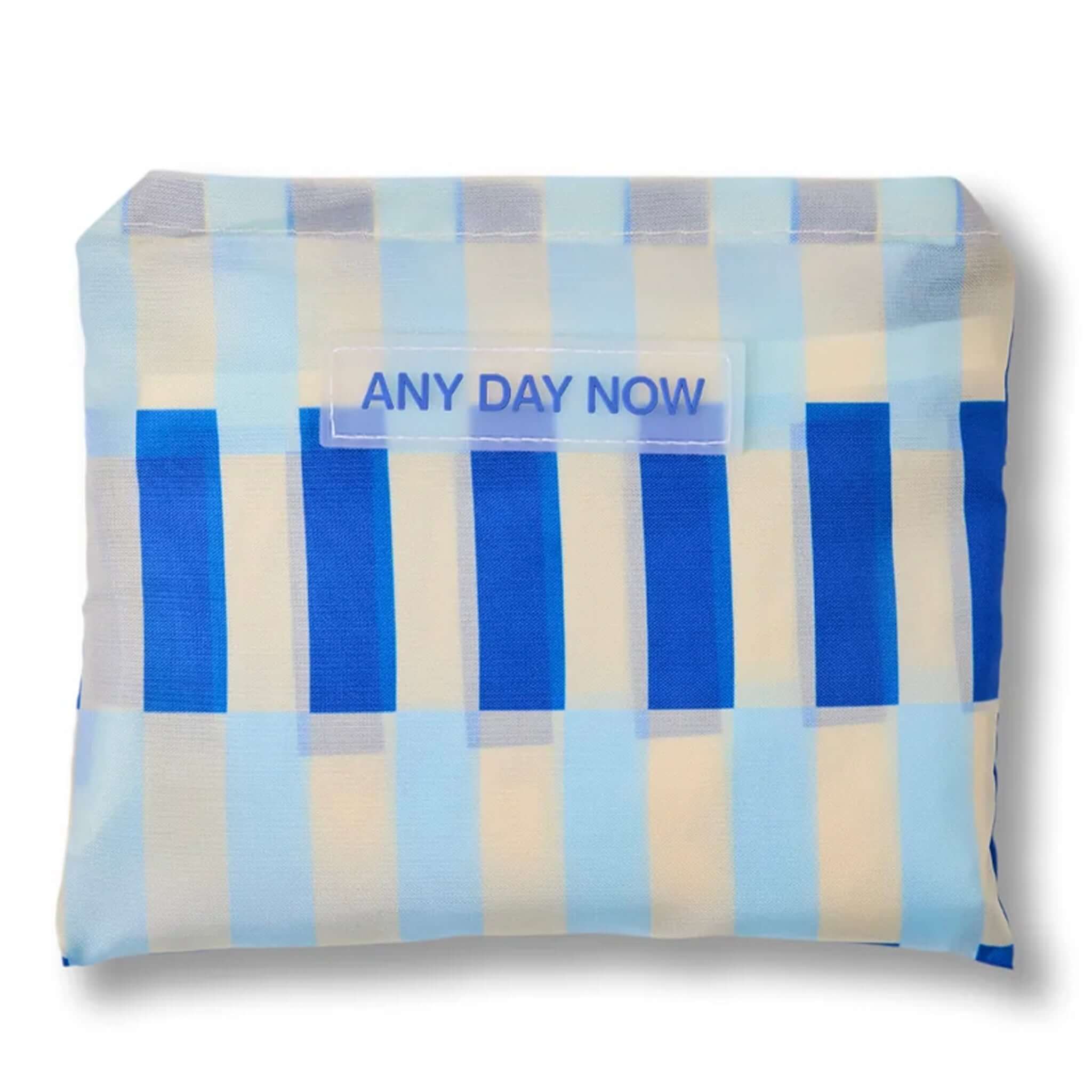 Any Day Now Any Where Tote - Blue & White folded into a compact pouch with blue and white stripes.