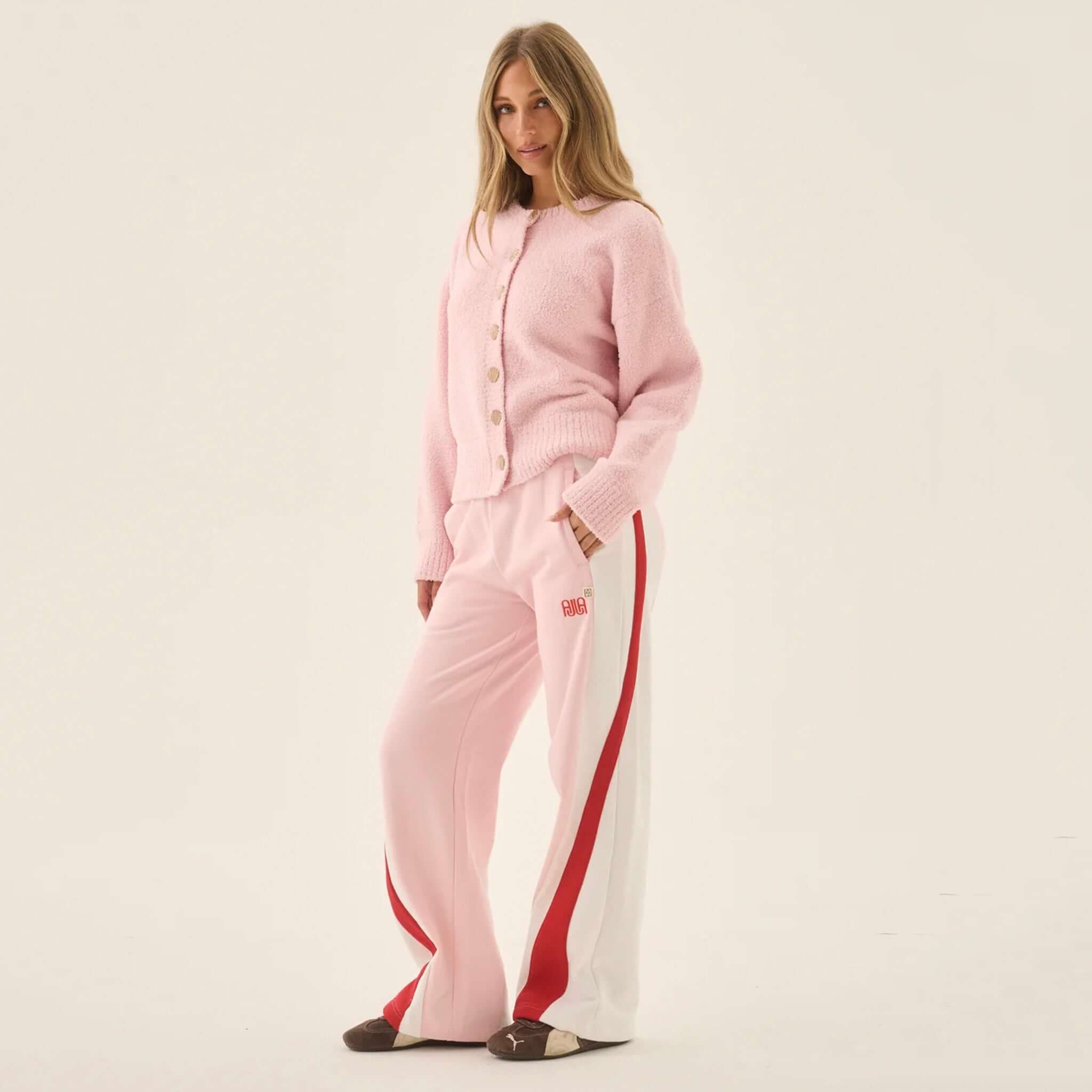 Araminta James Aimes Shell Cardigan - Ballet Pink worn with pink pants, showcasing a cosy and feminine style.