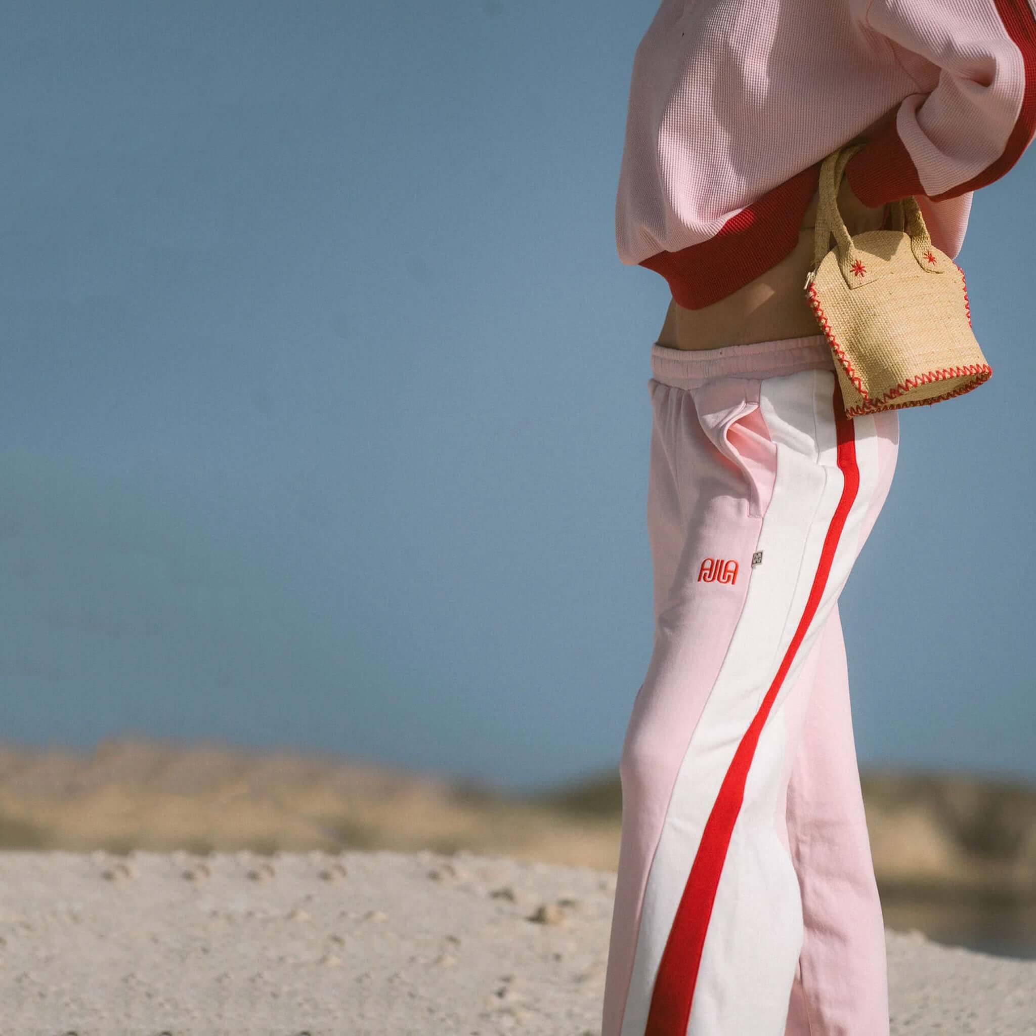Araminta James Mallorca Trackpants - Ballet Pink, featuring bold side panels and wide leg, perfect for a relaxed style.