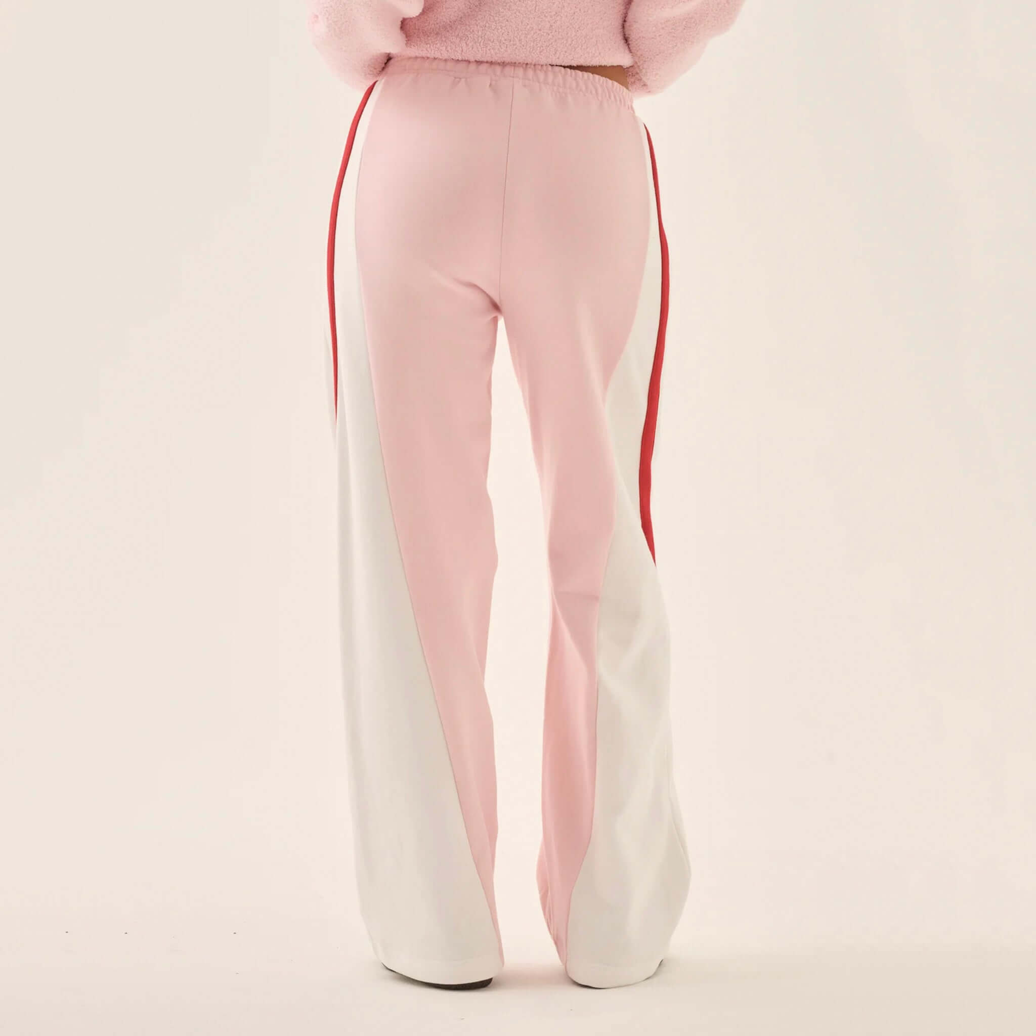 Araminta James Mallorca Trackpants - Ballet Pink showcasing back view with cream and red side panels.