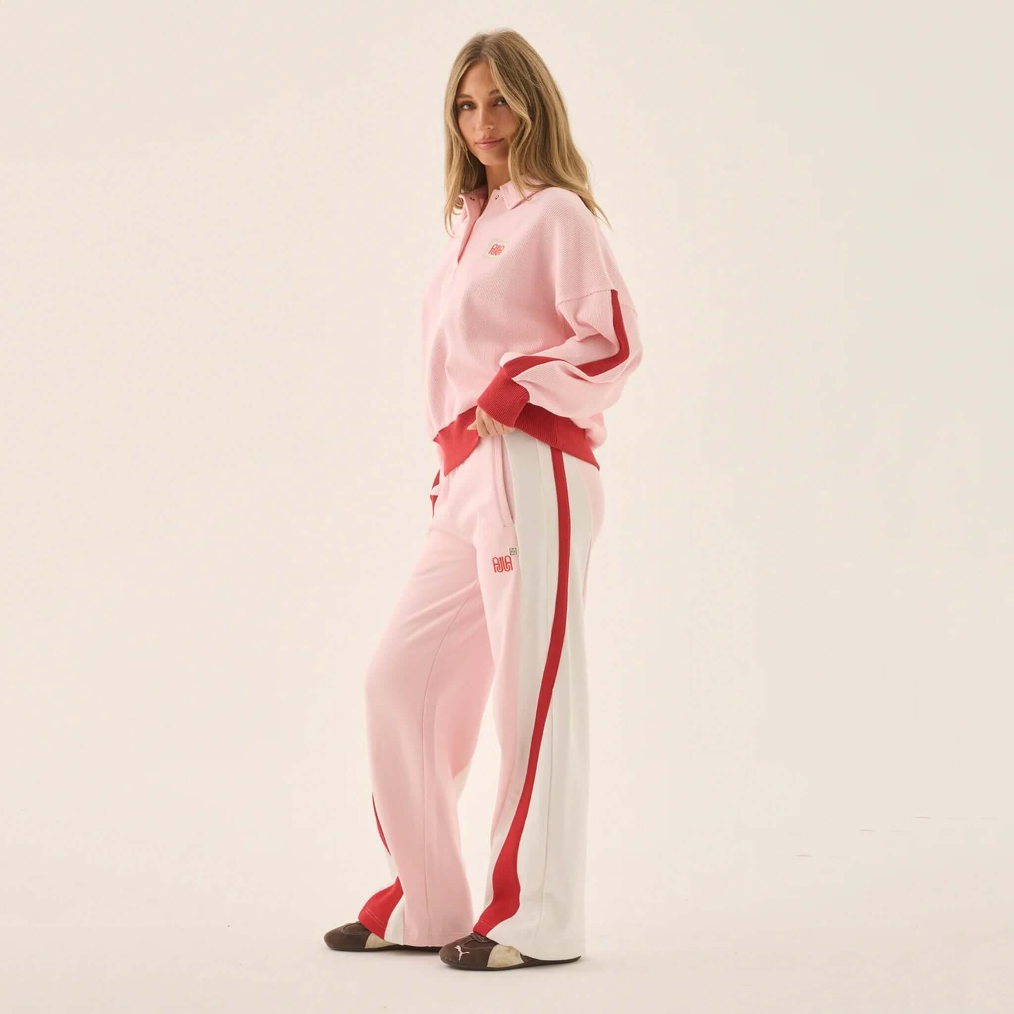 Araminta James Mallorca Trackpants - Ballet Pink worn with a matching top, showcasing color-blocked design and stylish relaxed fit.