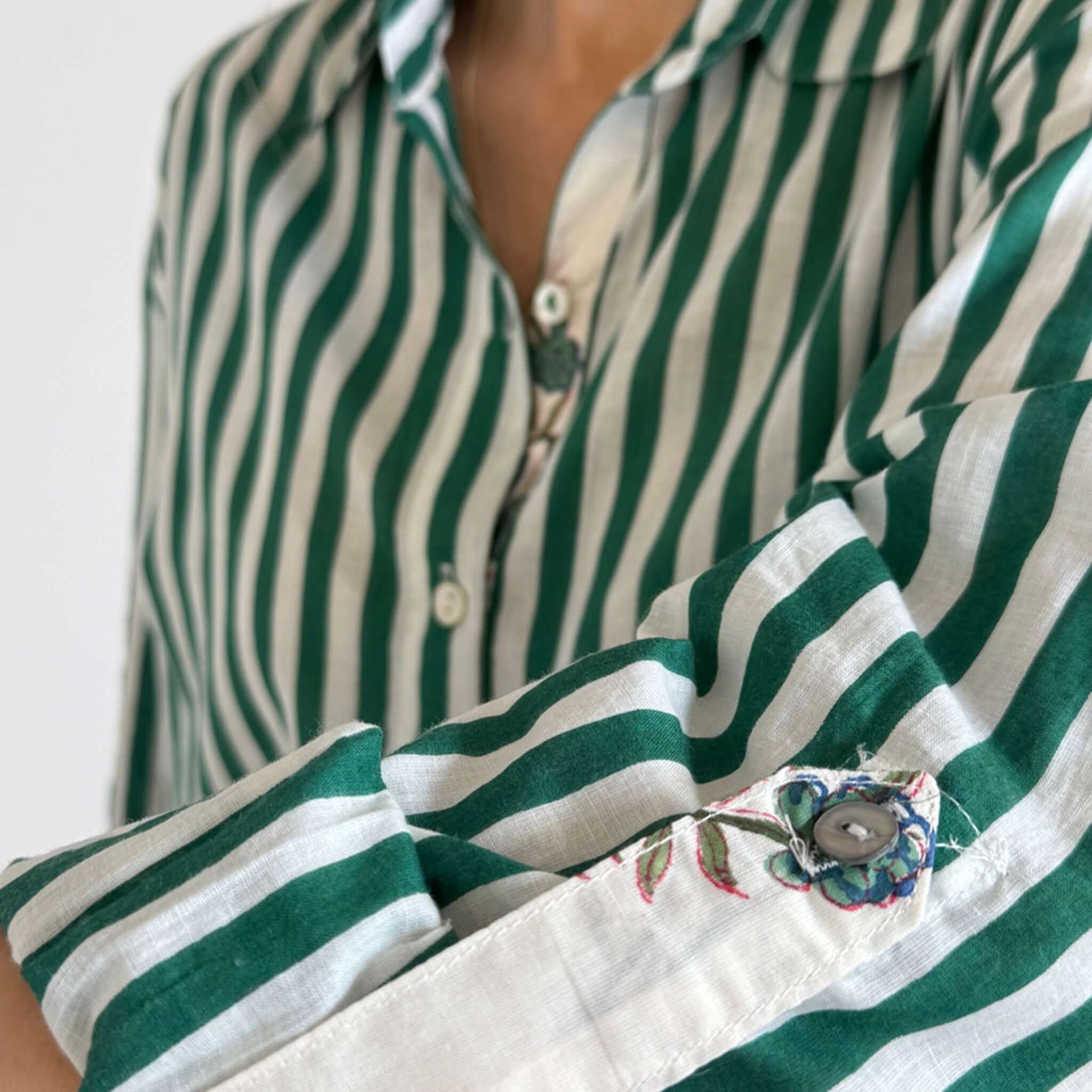 Art In My Wardrobe Annie Shirt - Green featuring bold green and white stripes and floral button details.