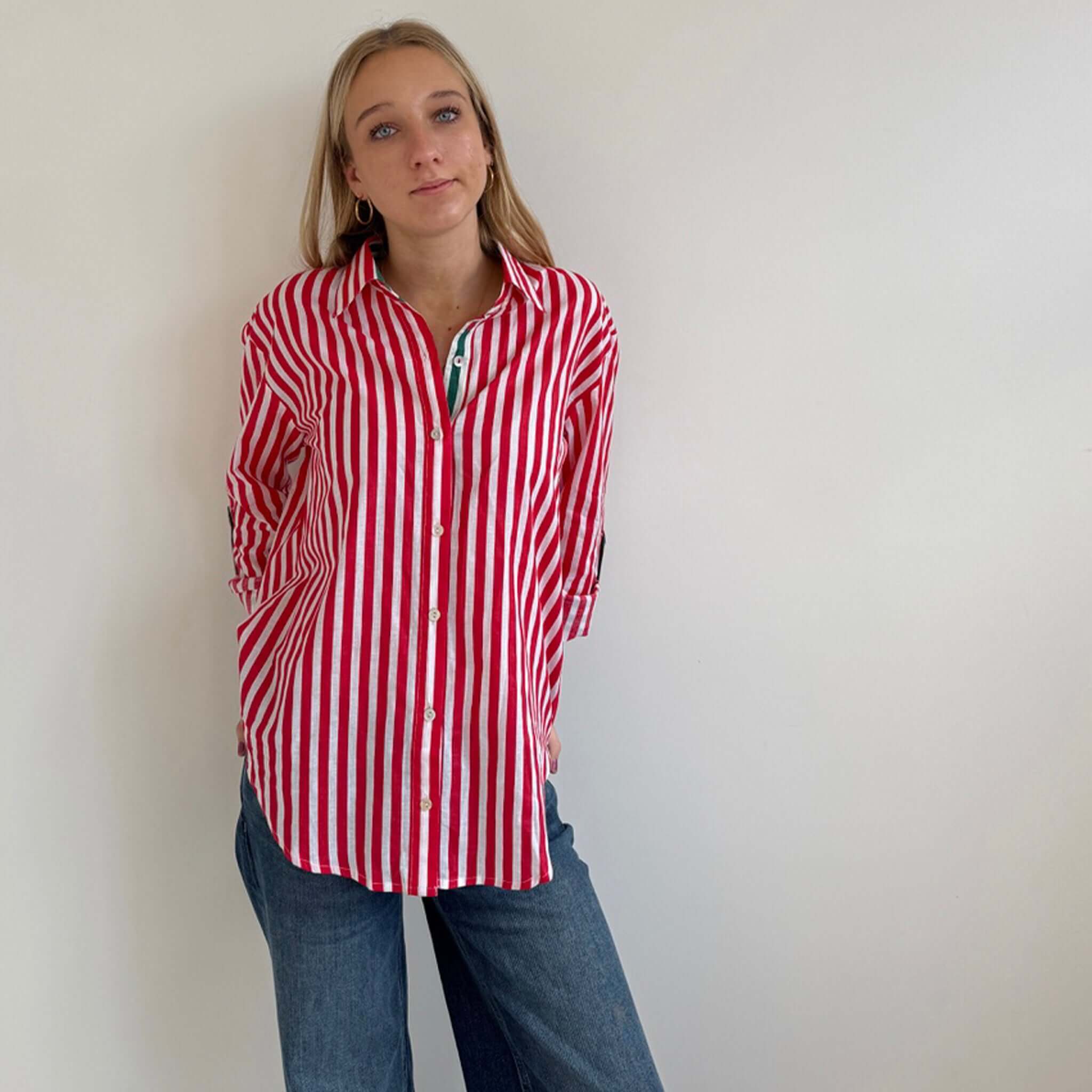 Model wearing Art In My Wardrobe Annie Shirt - Red with bold red and white stripes, green placket, and embroidered heart.