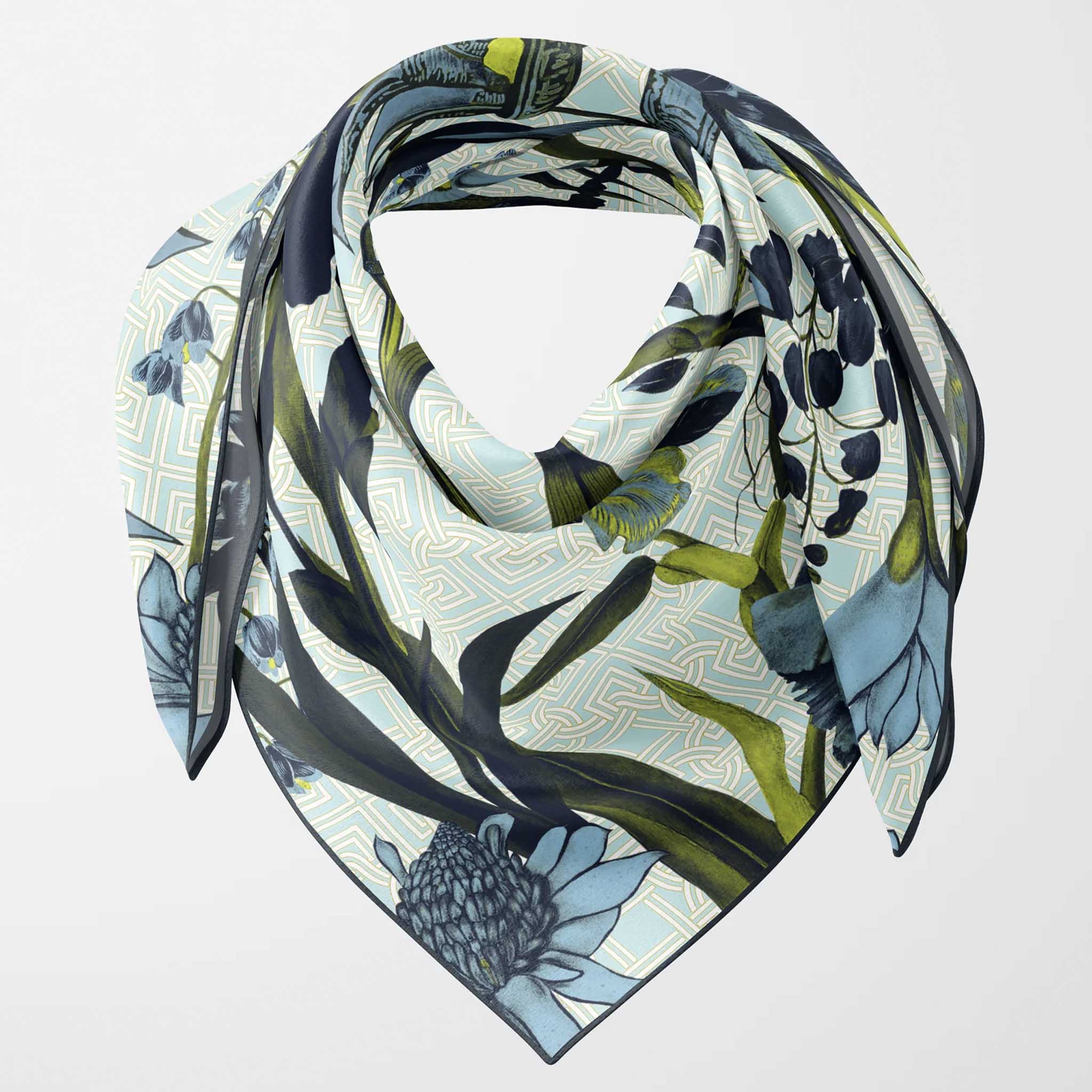 Alt Tag: Artifact Square Silk Scarf - Eos with blue botanical print, vibrant yellow accents, and cream geometric background silk twill
