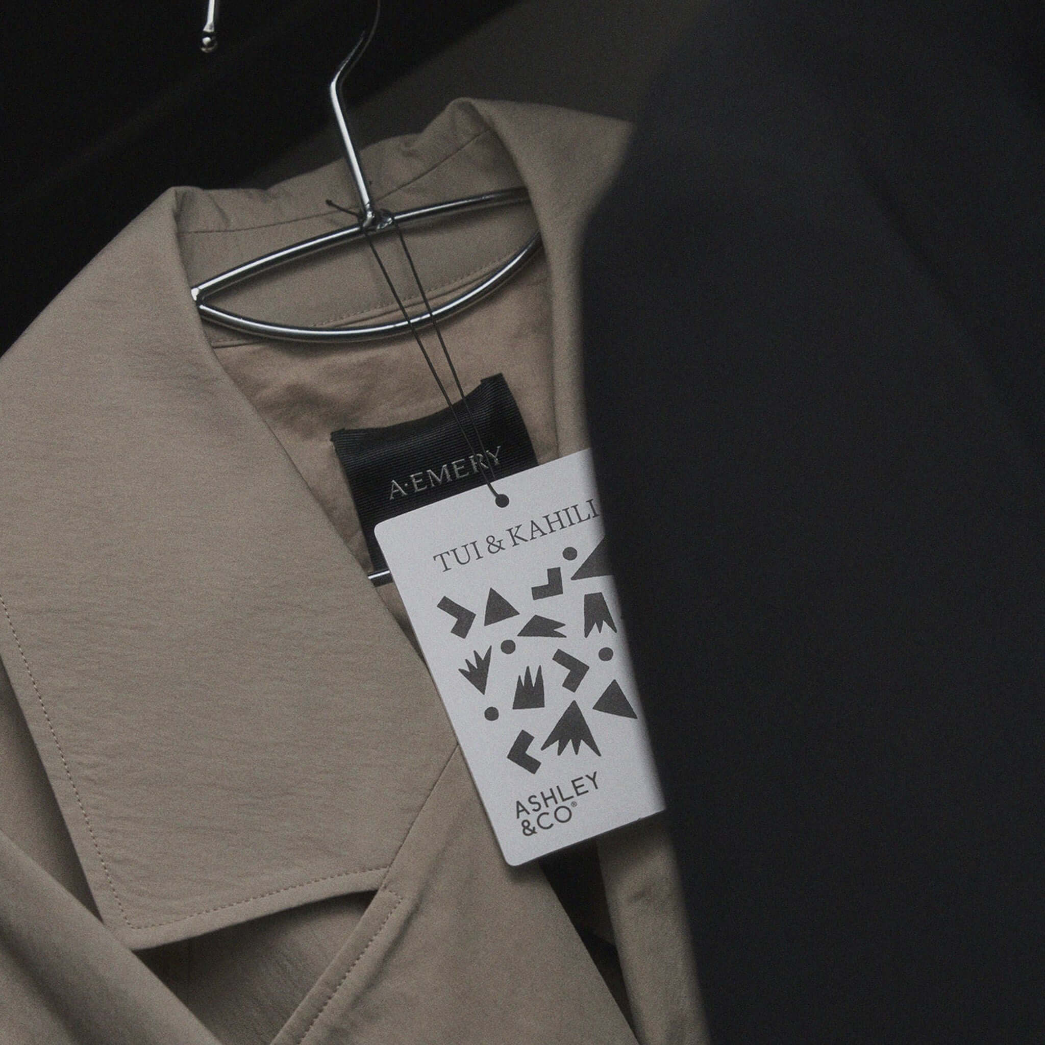 Alt Tag: Ashley & Co Carded Perfume Air Freshener - Tui & Kahili hanging in wardrobe, tropical florals and warm sandalwood scent