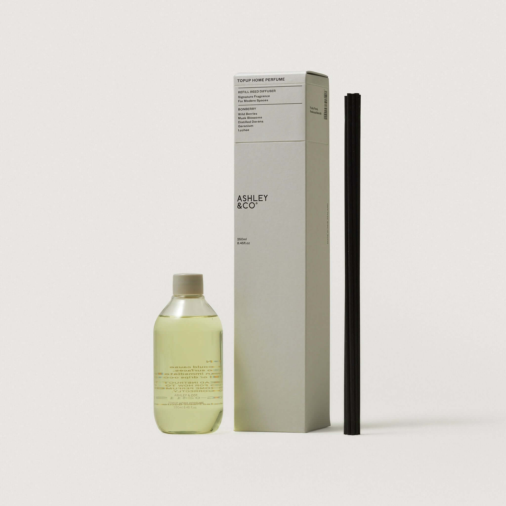 Ashley & Co TopUp Home Perfume Refill Kit with bottle and reed sticks, perfect for keeping your home beautifully scented.
