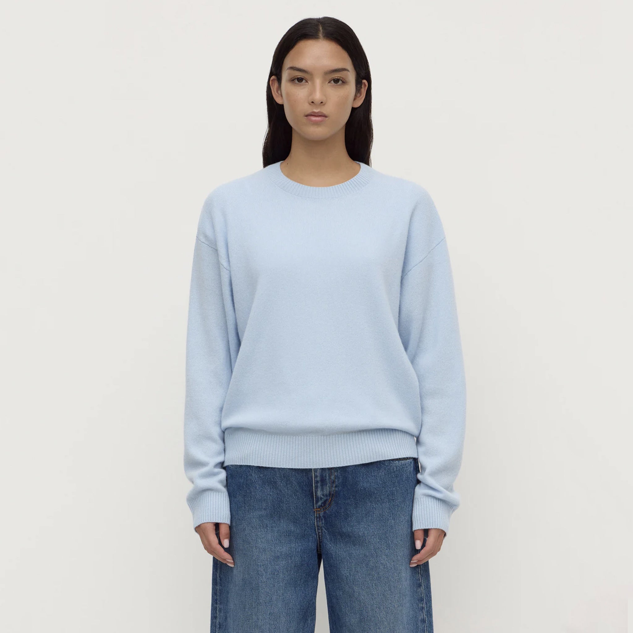 Assembly Label Carter Brushed Merino Wool Sweater - Breeze displayed on a model in a light blue color.