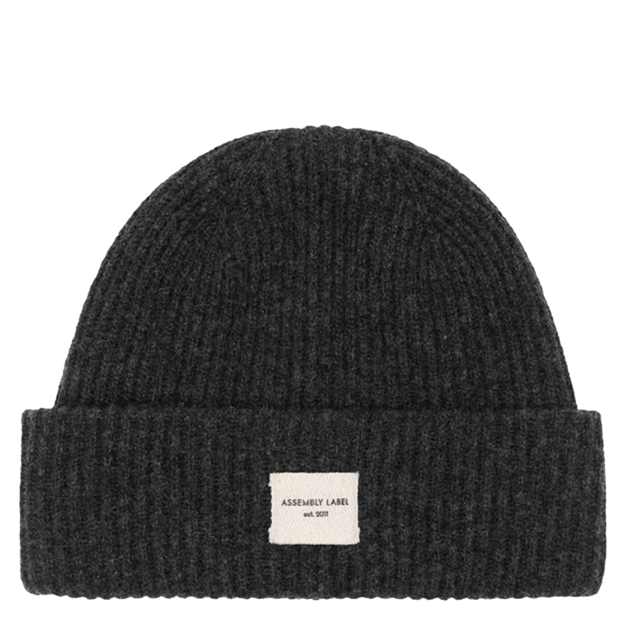 Assembly Label Merino Wool Rib Beanie - Charcoal Marle displayed on a white background.