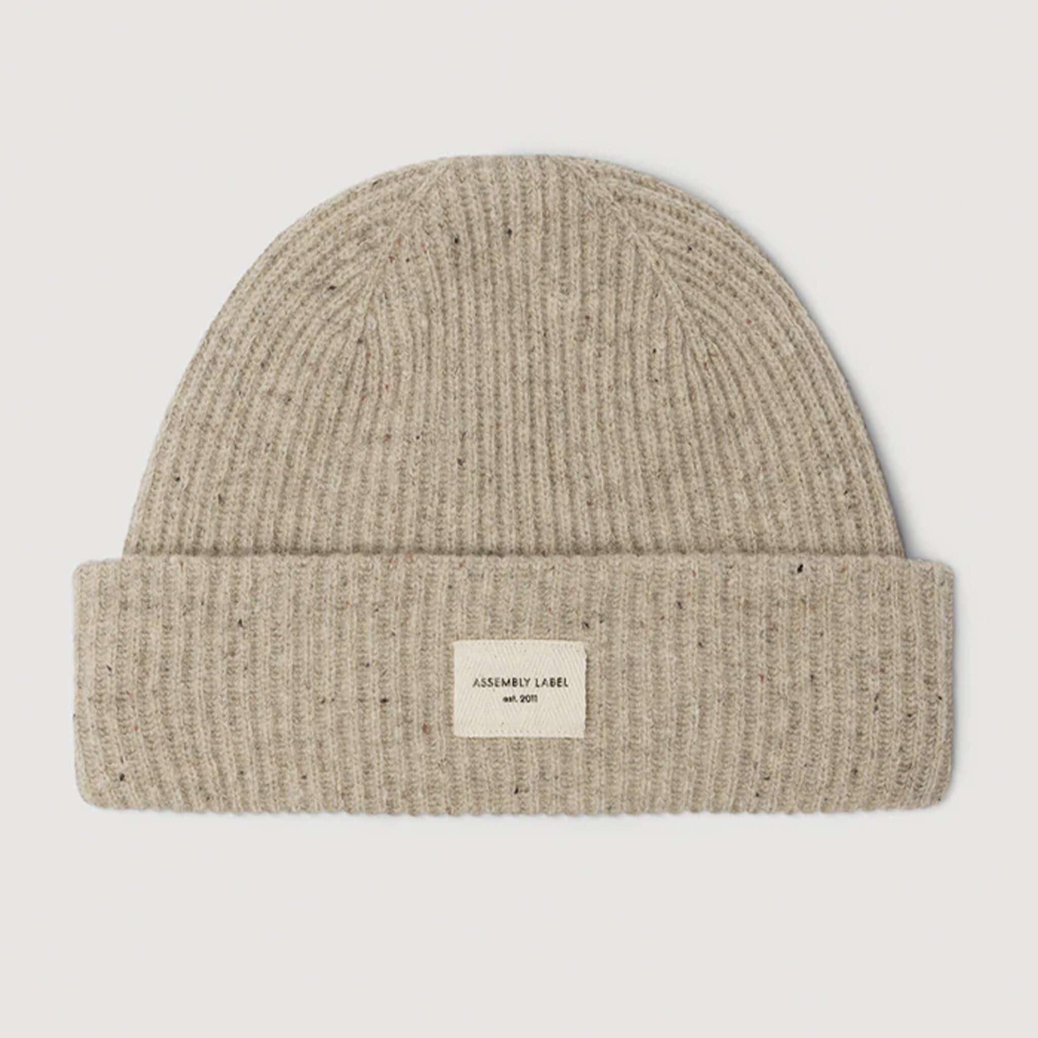 Assembly Label Merino Wool Rib Beanie - Stone Marle, soft ribbed design with fold-over cuff and herringbone patch.