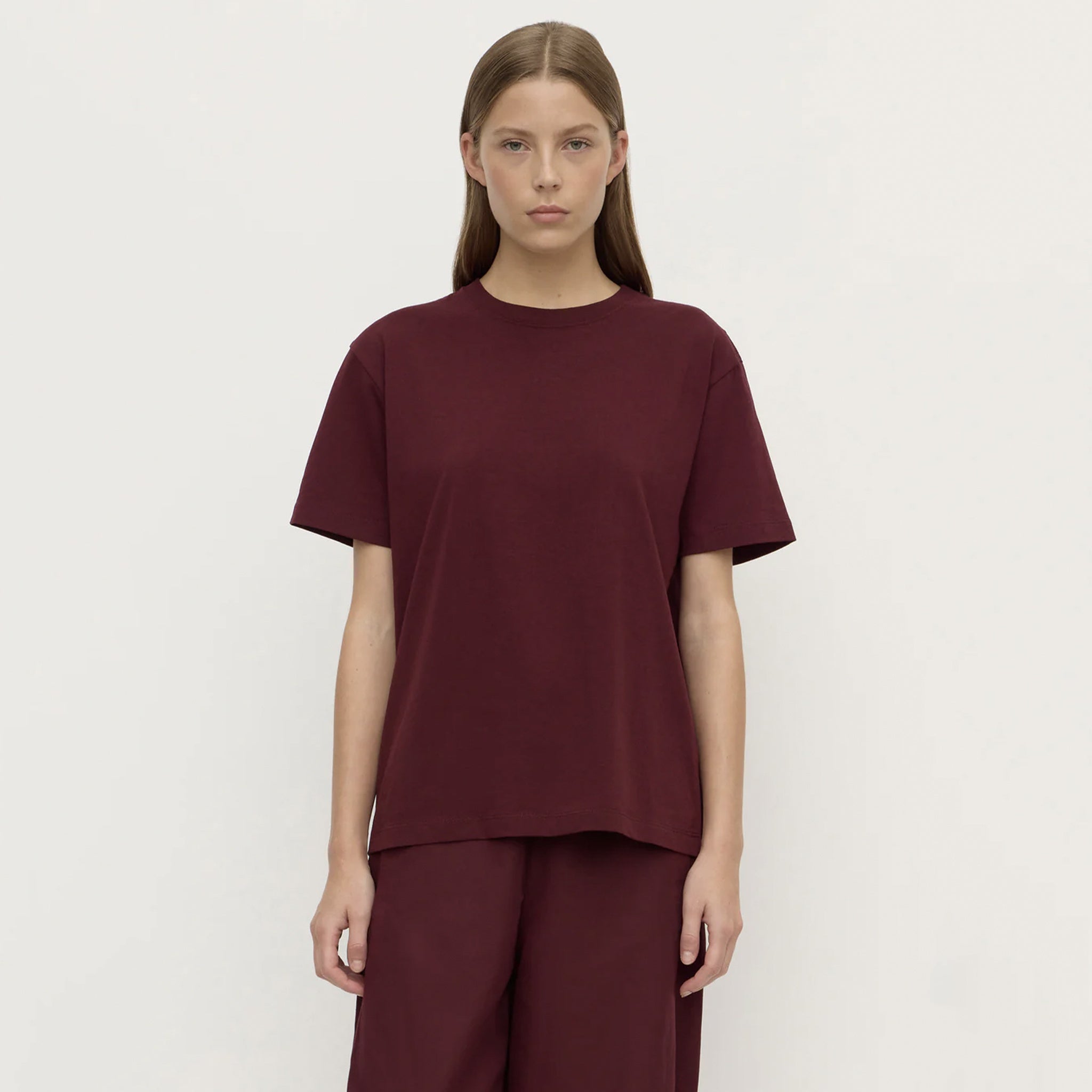 Assembly Label Organic Cotton Base Tee - Merlot on model, relaxed crew neck organic cotton jersey t-shirt in merlot shade