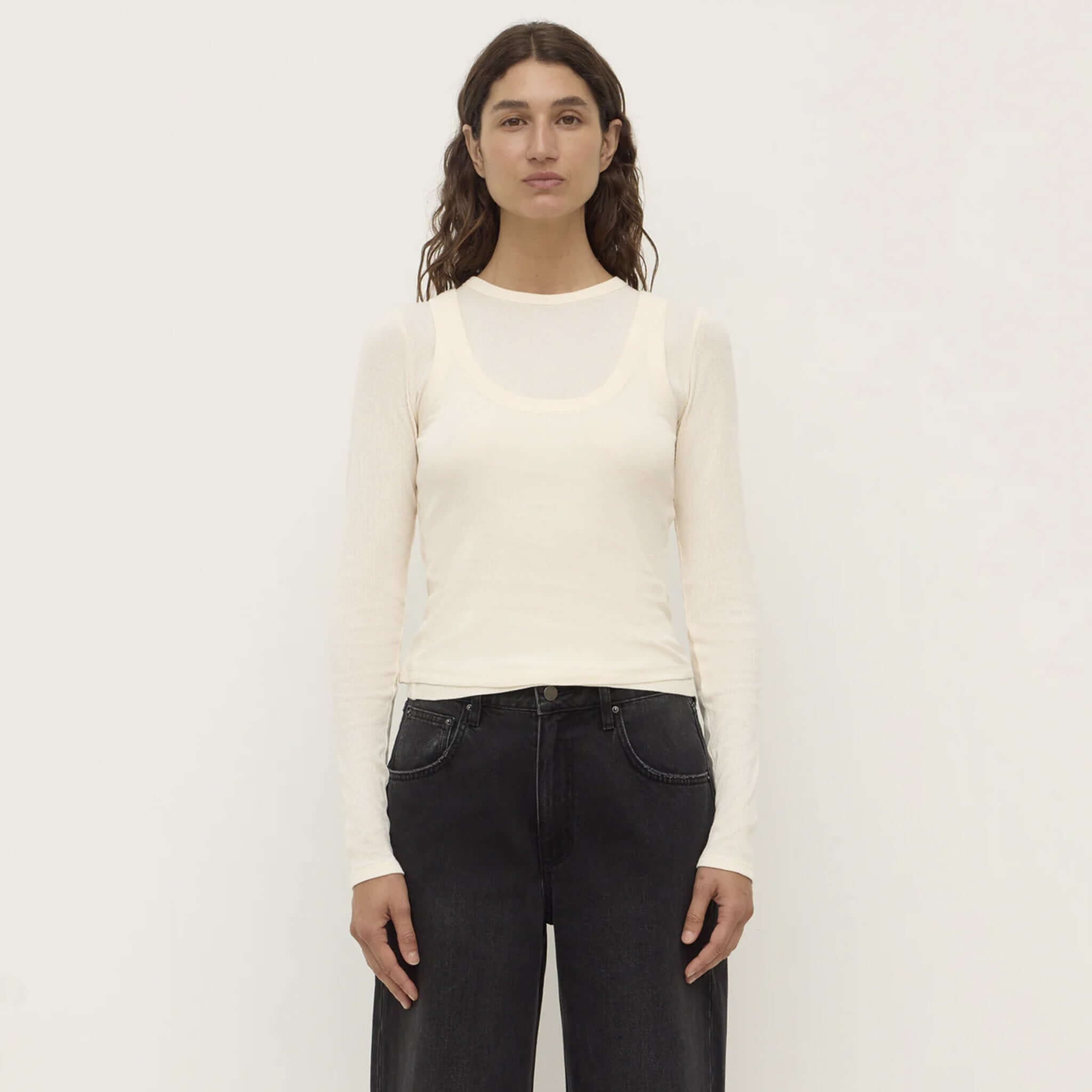 Alt Tag: Assembly Label Zali Long Sleeve Tee - Cream on model, ribbed fitted cotton crew neck long sleeve top, slightly sheer base layer