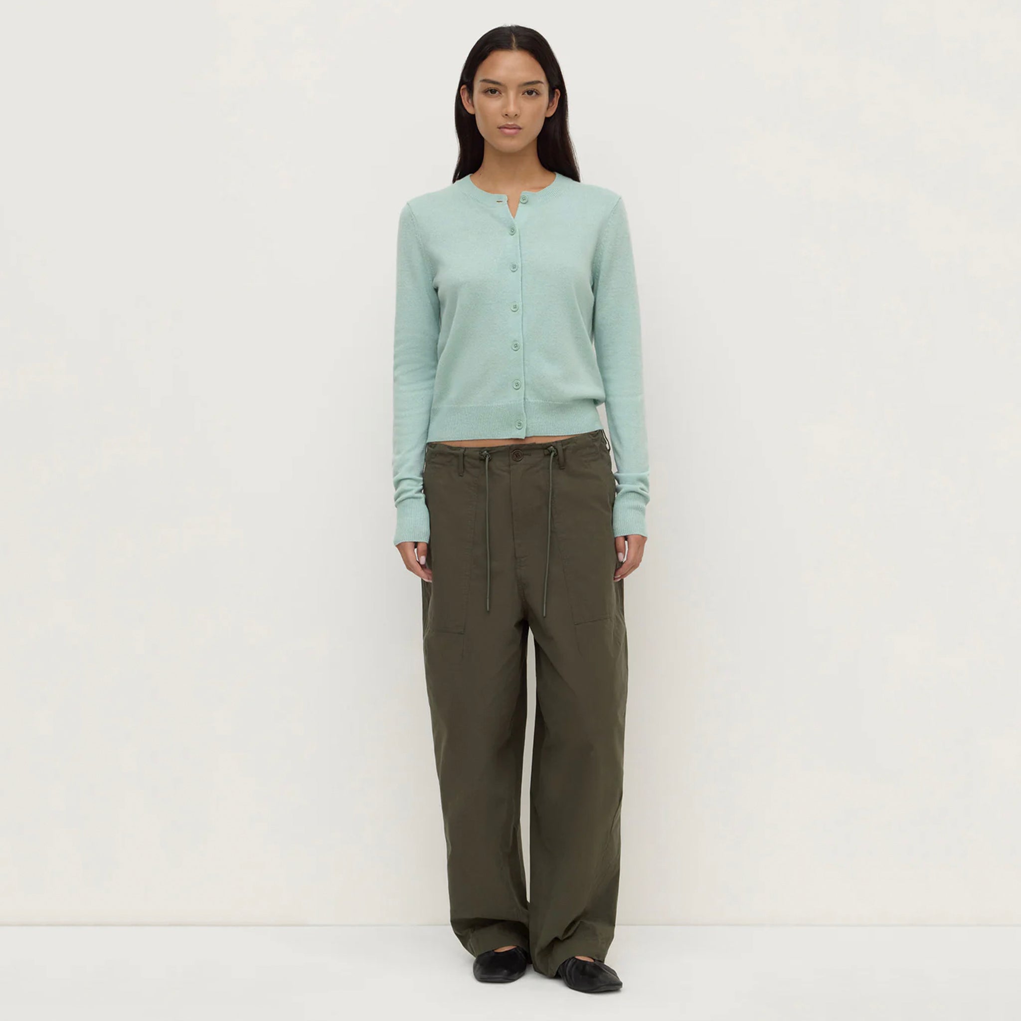 Assembly Label Benny Wool & Yak Knit Cardigan - Mint worn with loose trousers, showcasing the soft mint color.