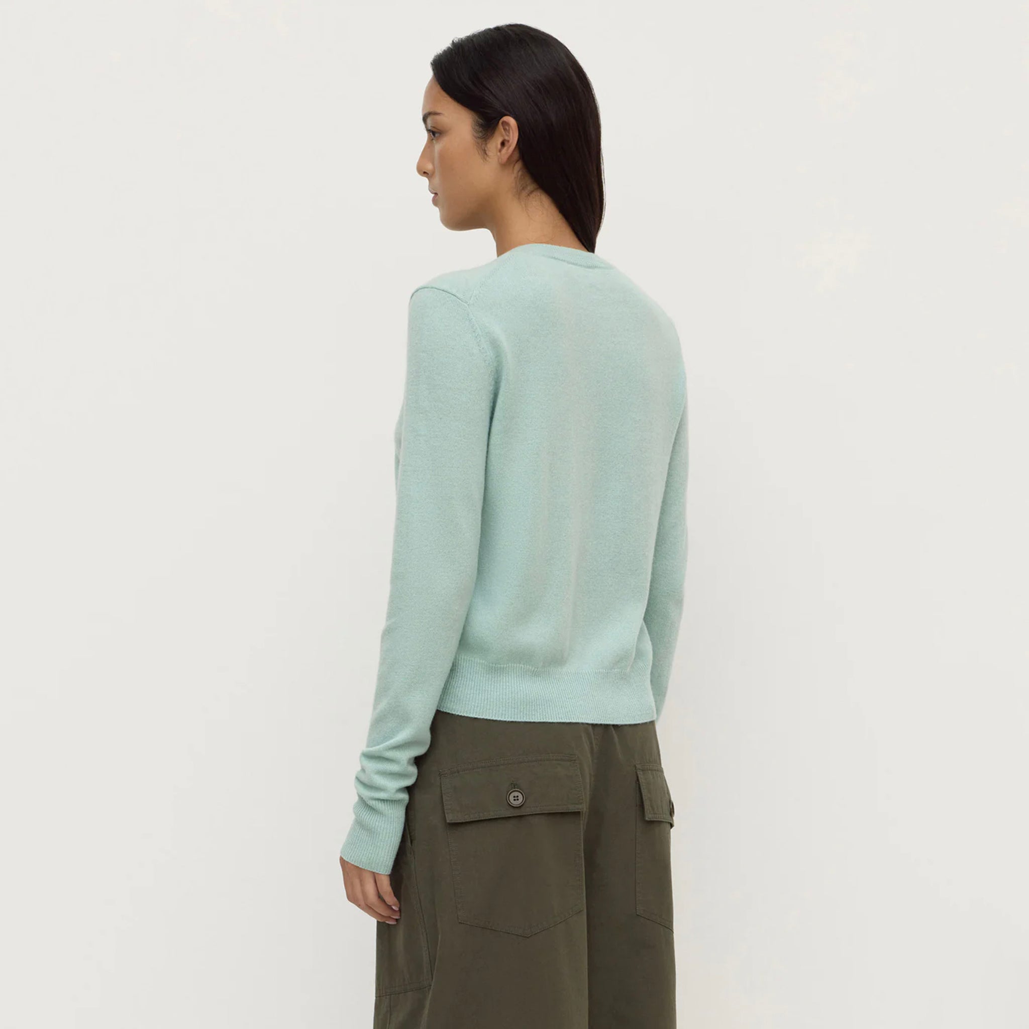 Assembly Label Benny Wool & Yak Knit Cardigan - Mint worn from the back, highlighting its soft mint color and crew neck design.