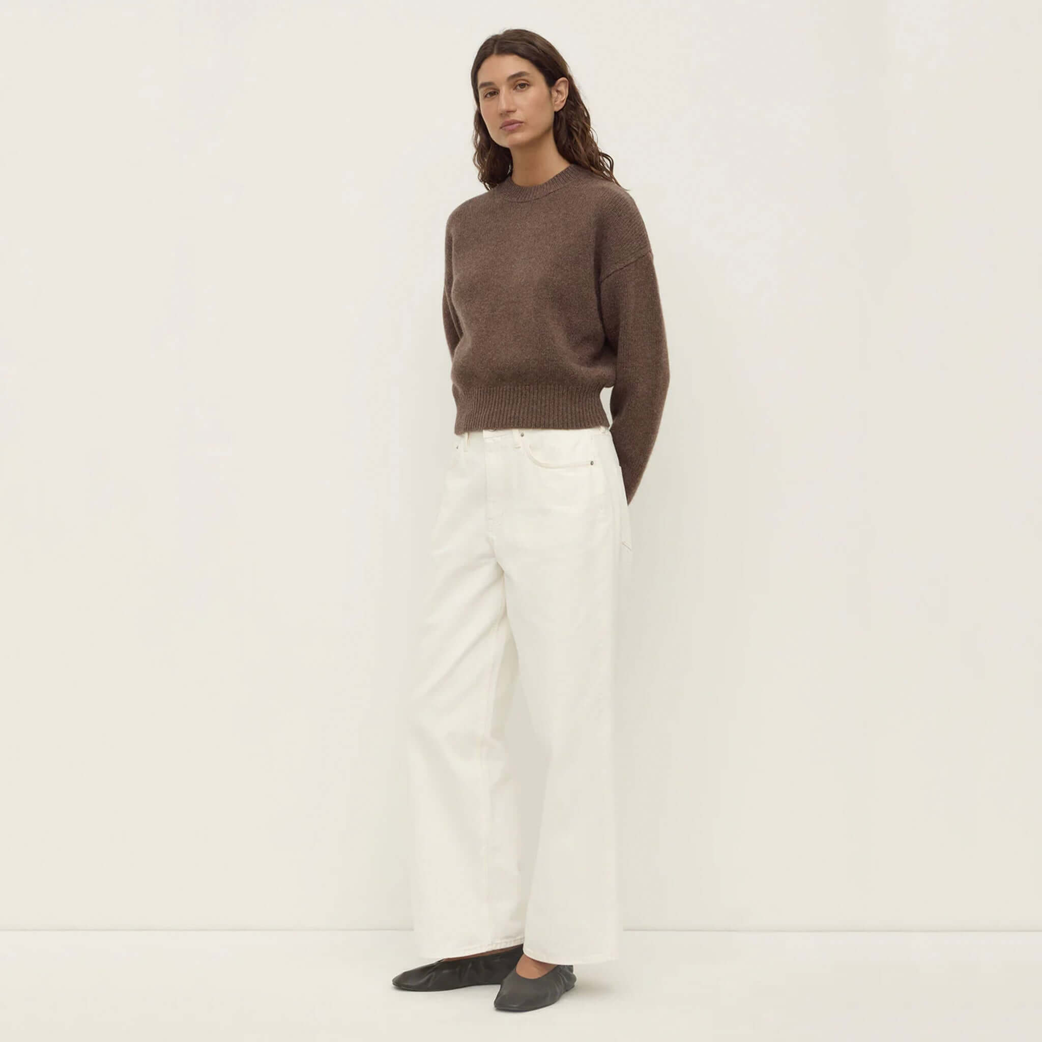 Alt Tag: Assembly Label Benny Wool & Yak Knit Jersey - Cocoa Marle on model, slightly cropped cocoa marle knit sweater styled with white jeans