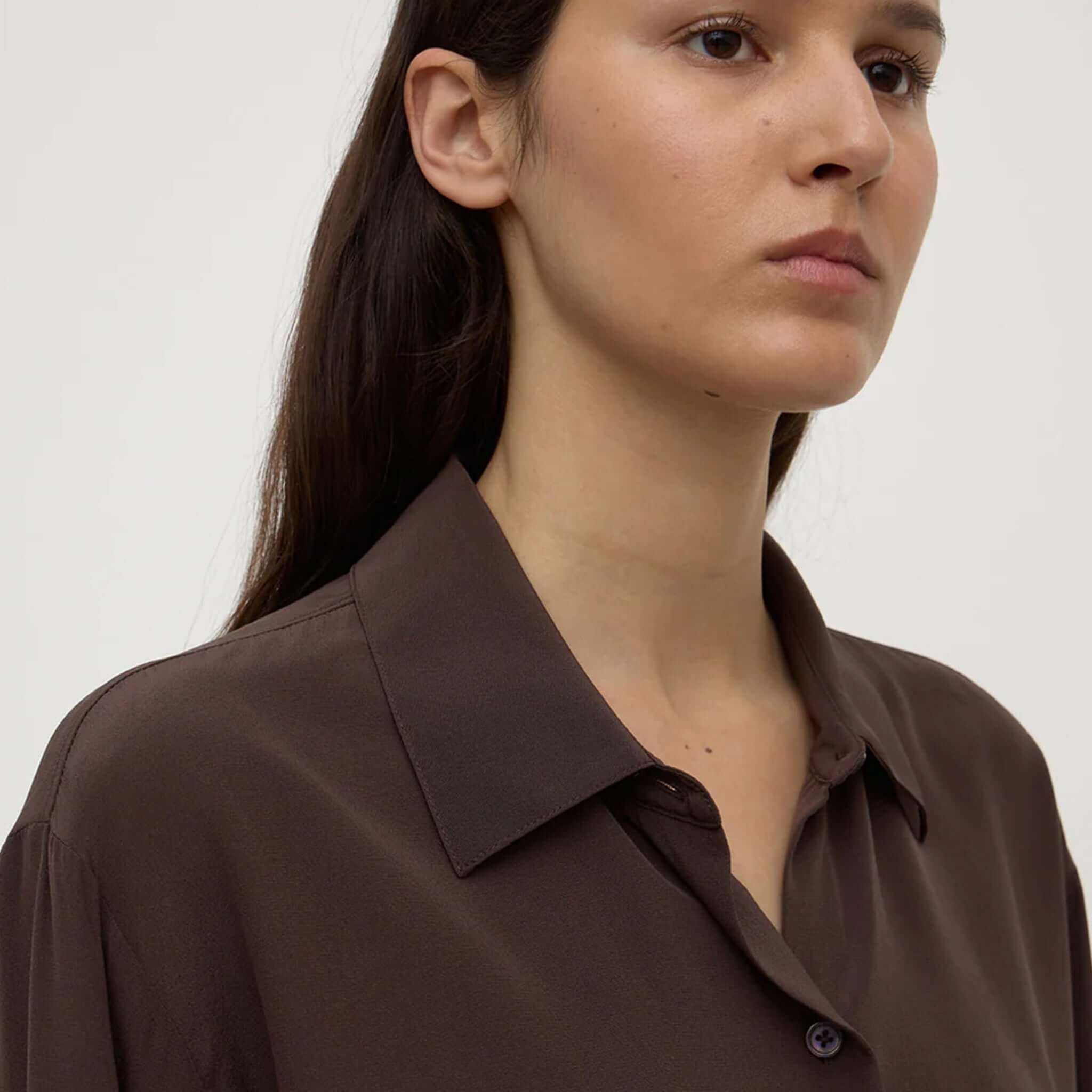 Alt Tag: Assembly Label Betty Silk Long Sleeve Shirt - Ganache close-up of silky ganache brown collar and button placket on model