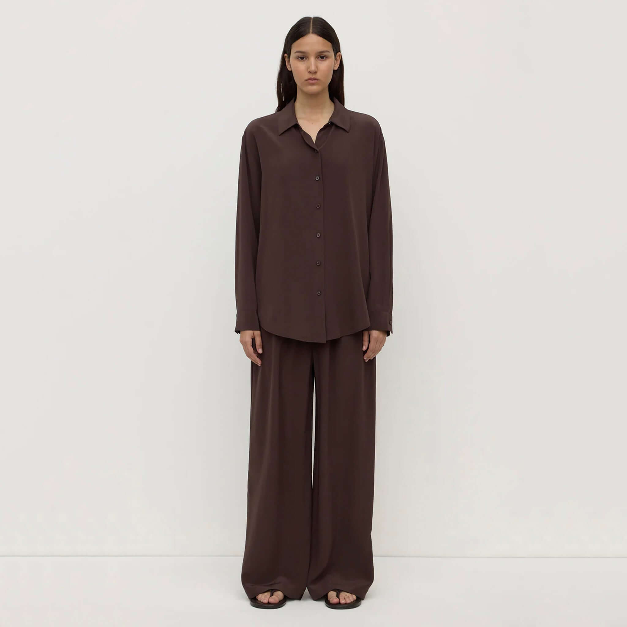 Alt Tag: Assembly Label Betty Silk Long Sleeve Shirt - Ganache on model, lightweight silk long sleeve button-up in rich ganache brown