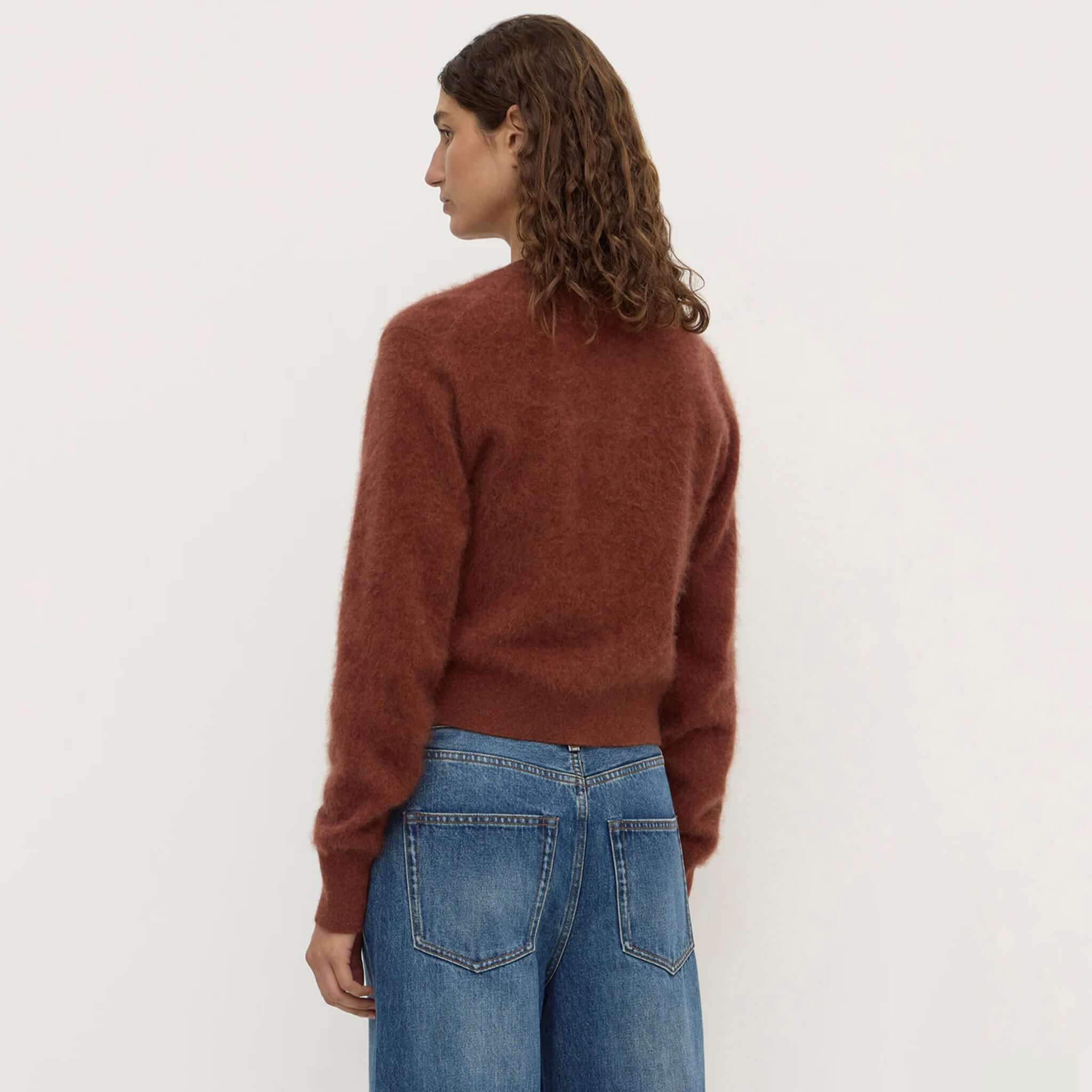 Assembly Label Carina Merino Wool Long Sleeve Cardigan - Burnt Amber shown from the back, featuring a cozy fit and stylish cropped length.