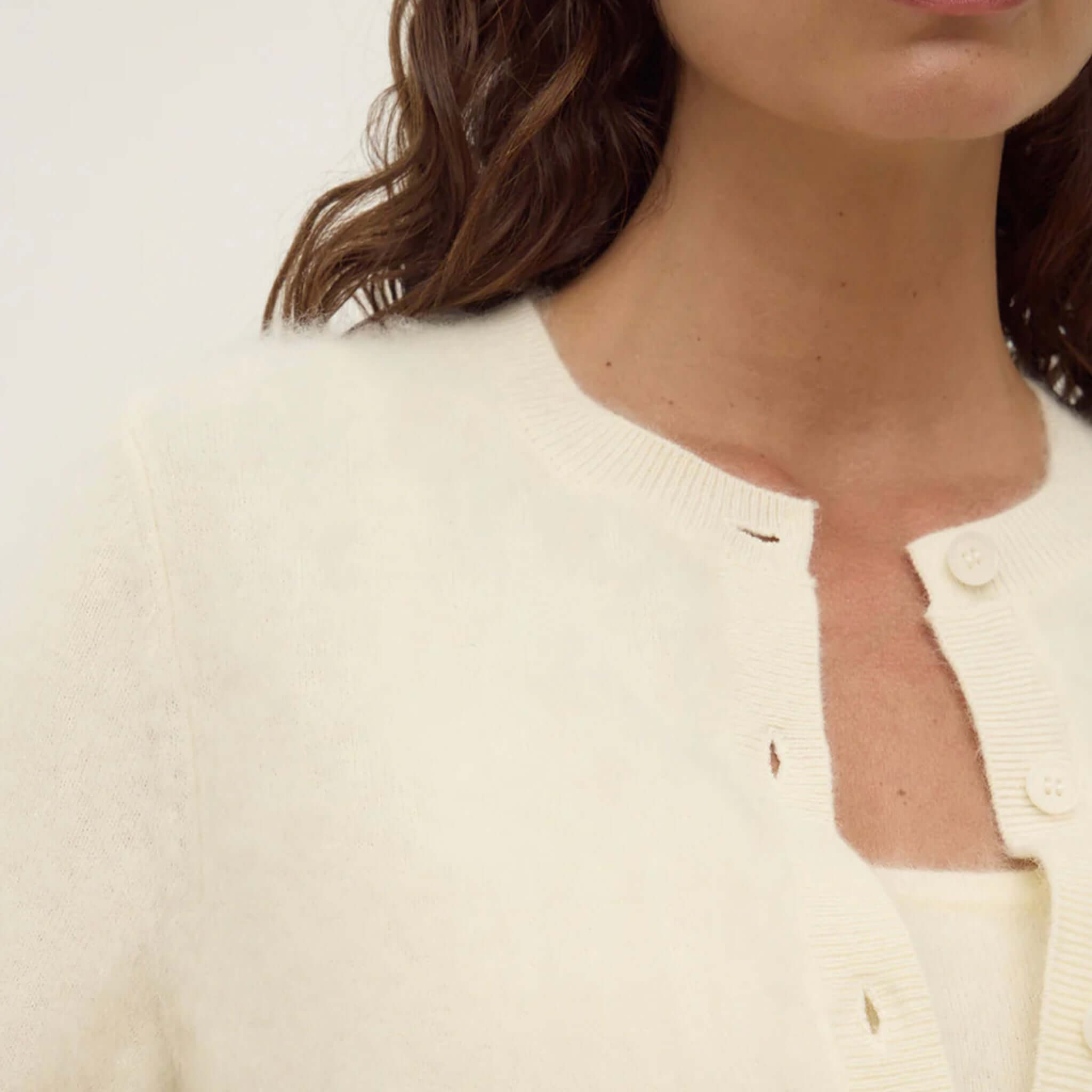 Alt Tag: Assembly Label Carina Merino Wool Short Sleeve Cardigan - Cream close-up of crew neckline and button placket in soft merino wool