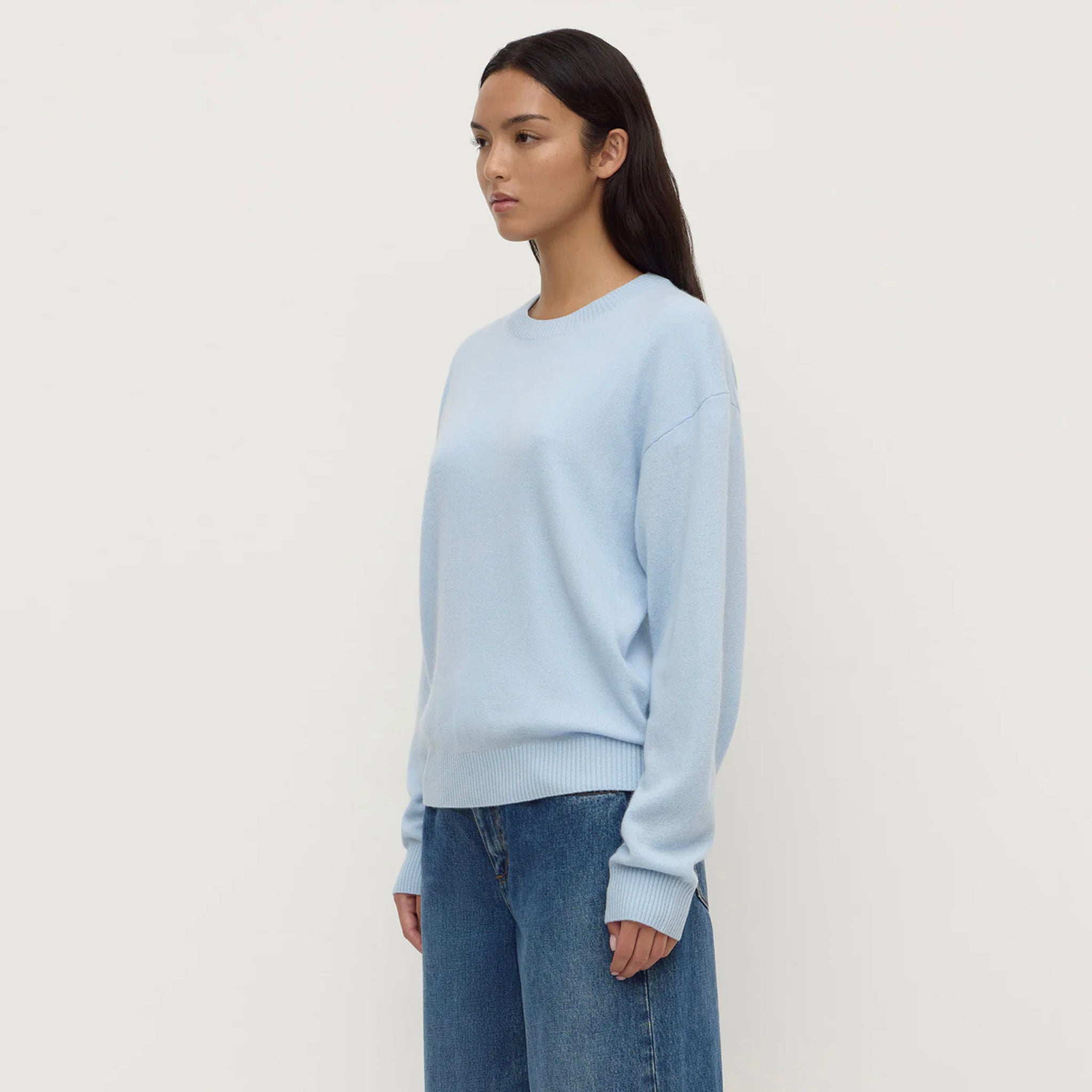 Assembly Label Carter Brushed Merino Wool Sweater - Breeze in light blue on model with dropped shoulders.