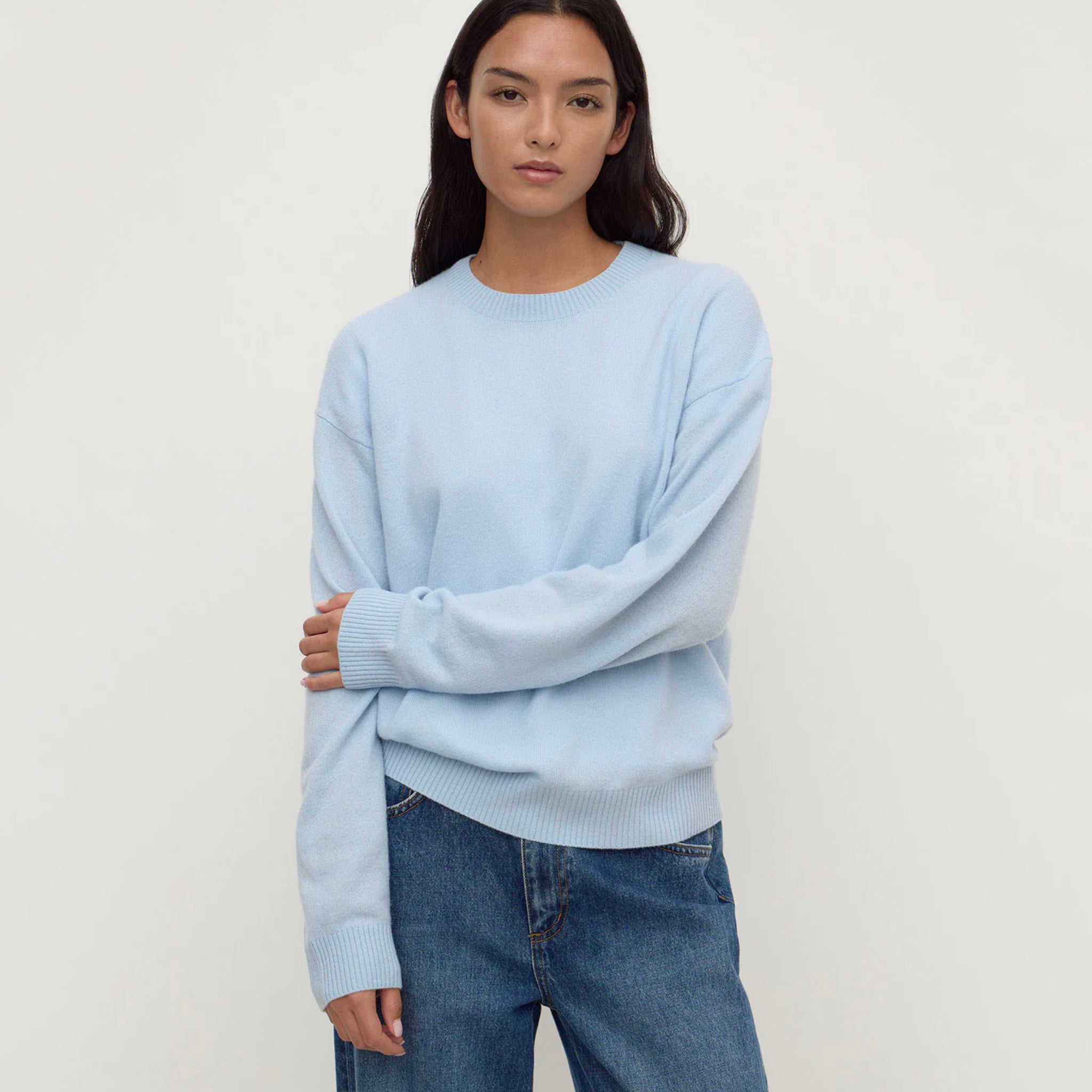 Assembly Label Carter Brushed Merino Wool Sweater - Breeze in light blue worn by a model.