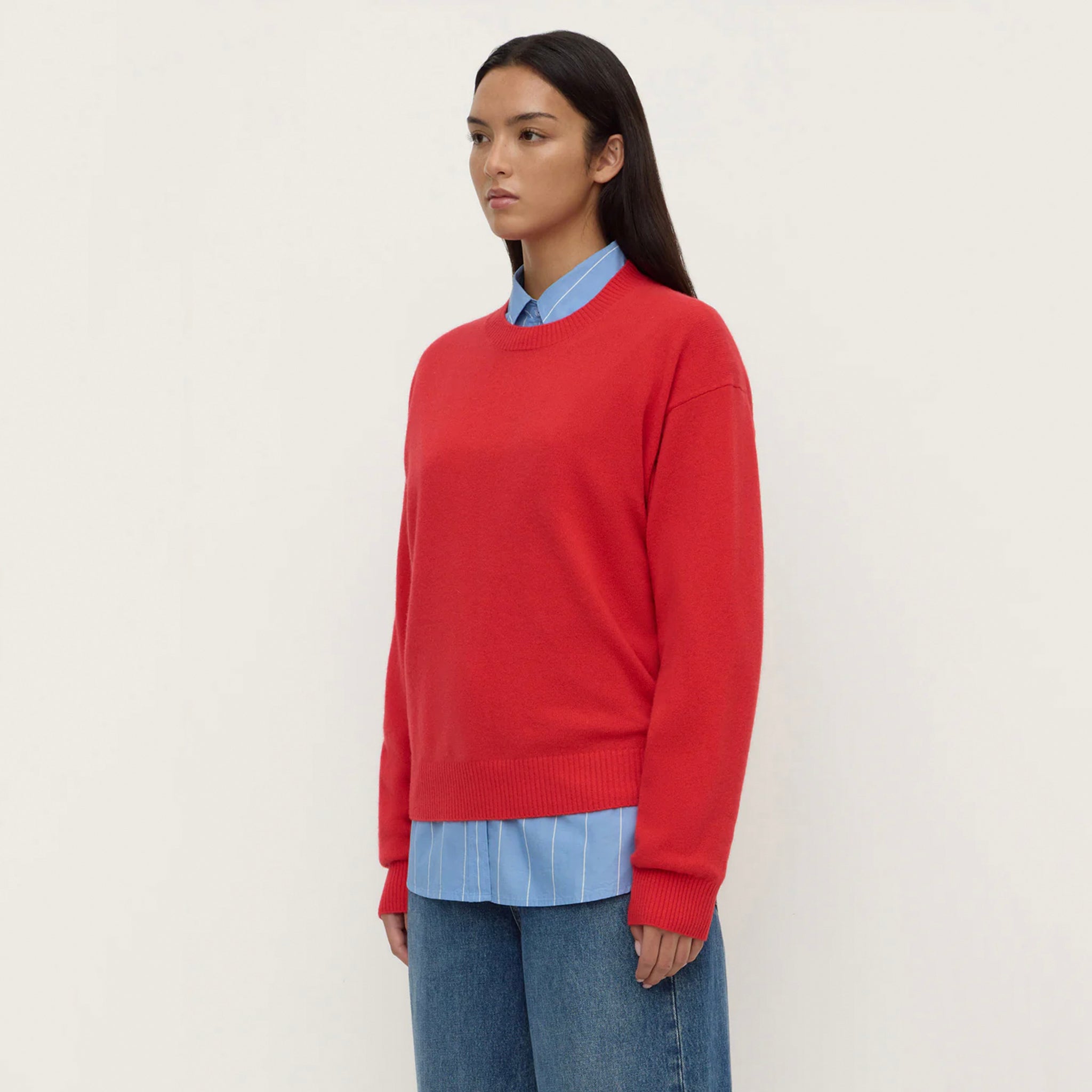 Assembly Label Carter Brushed Merino Wool Sweater - Flame on a model, showcasing its vibrant red color and relaxed fit.