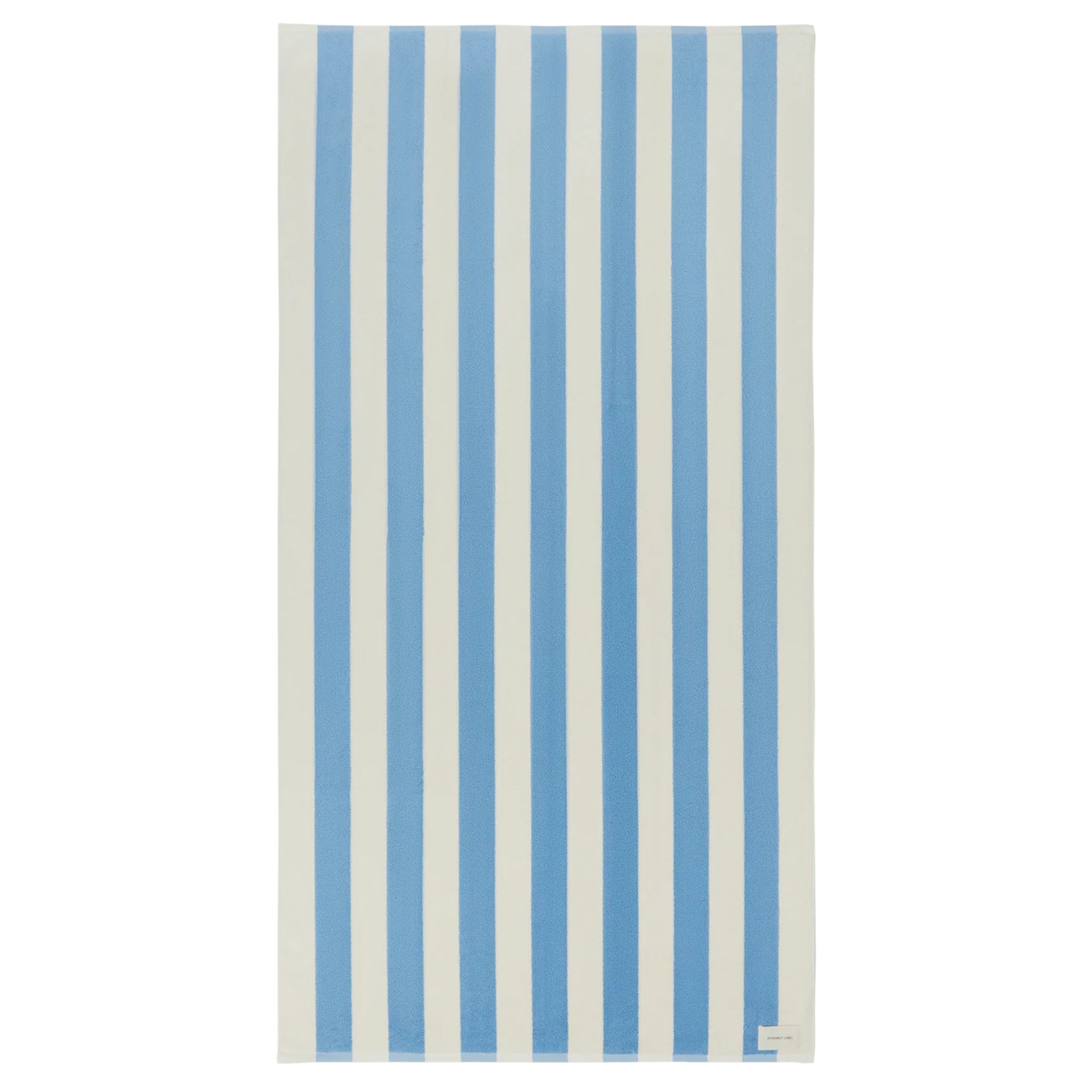 Striped towel with blue and white vertical stripes on a white background