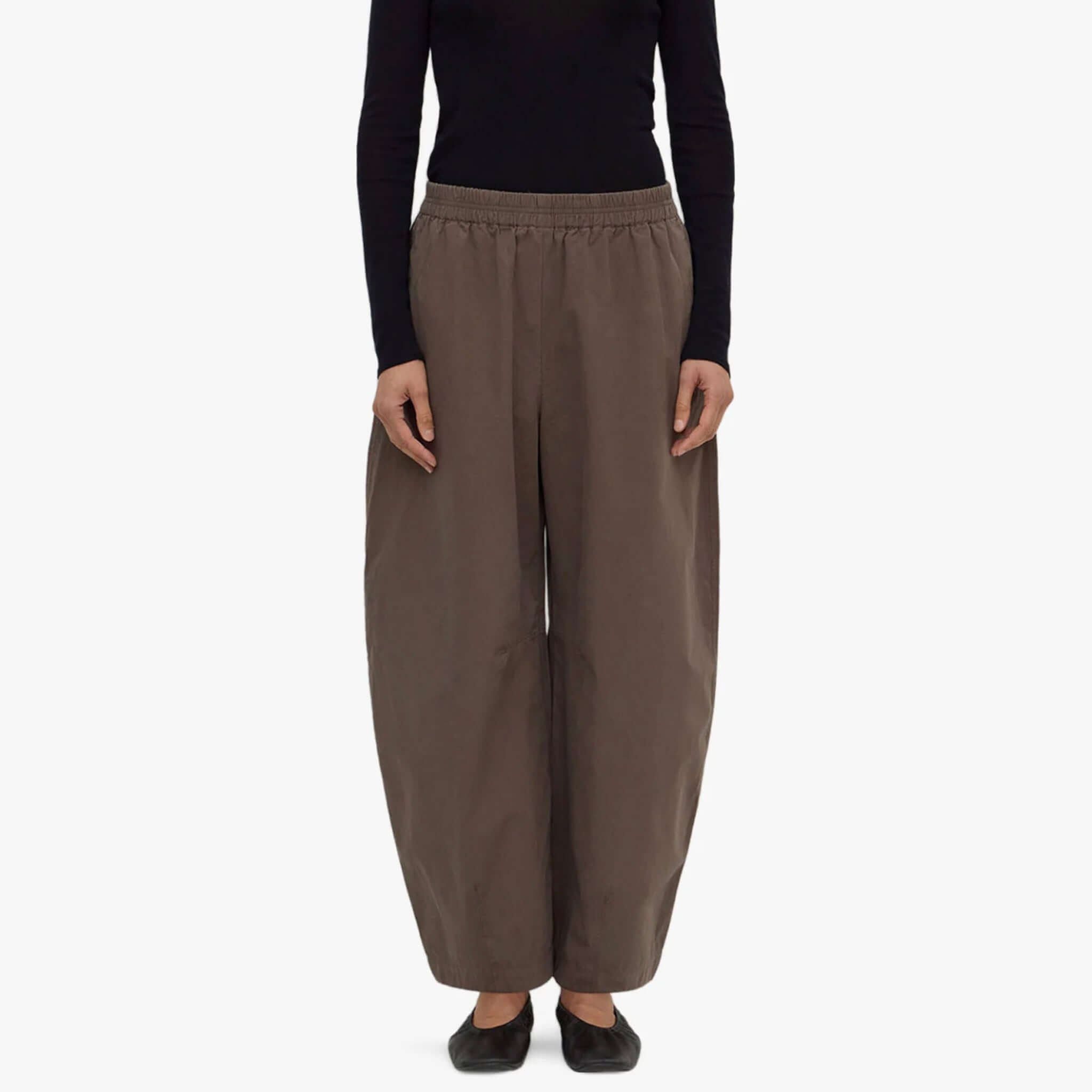 Assembly Label barrel pants in bark color with voluminous legs and elasticated waistband worn by a model.