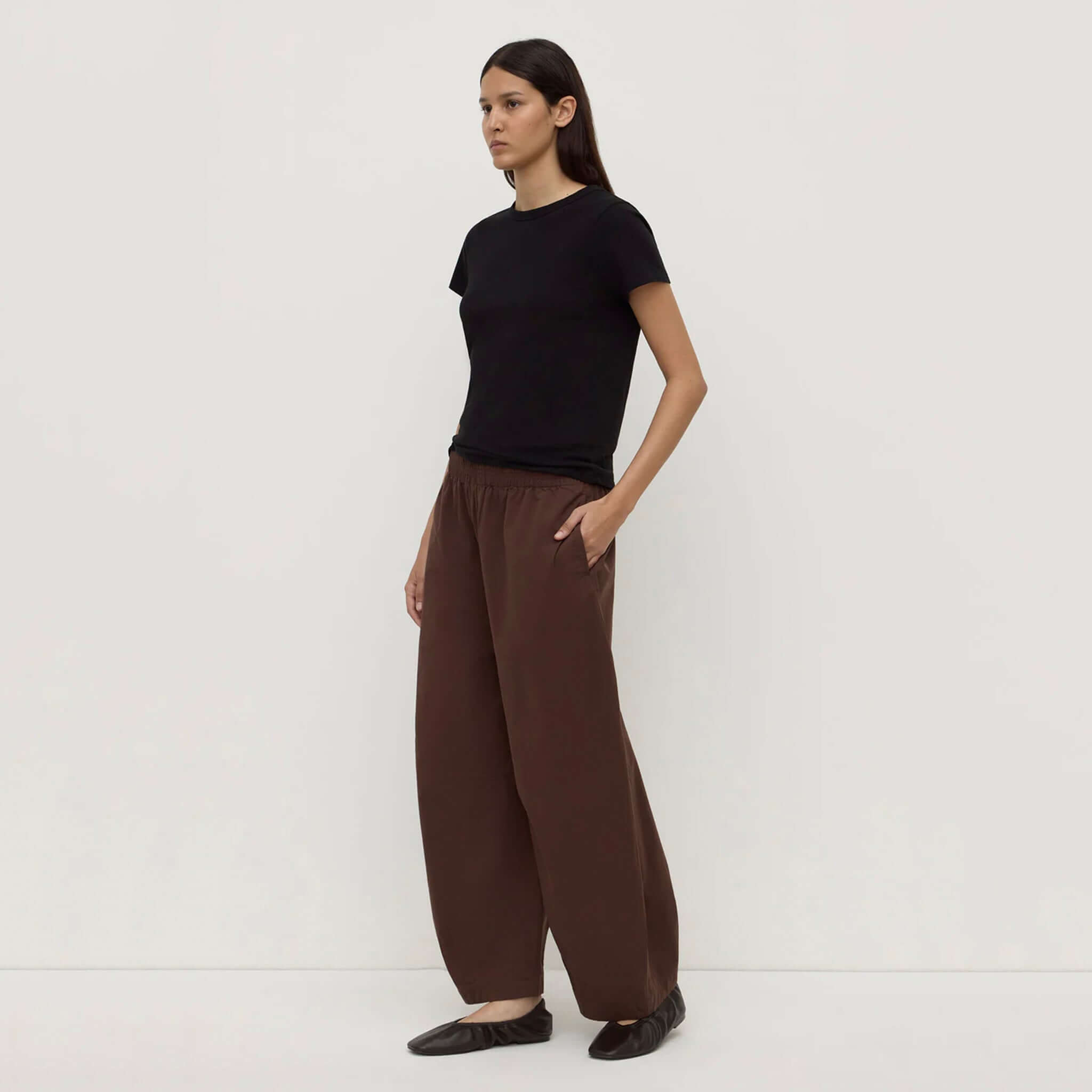 Model wearing Assembly Label Lola Barrel Pants - Ganache paired with a black tee, showcasing relaxed fit and comfort.