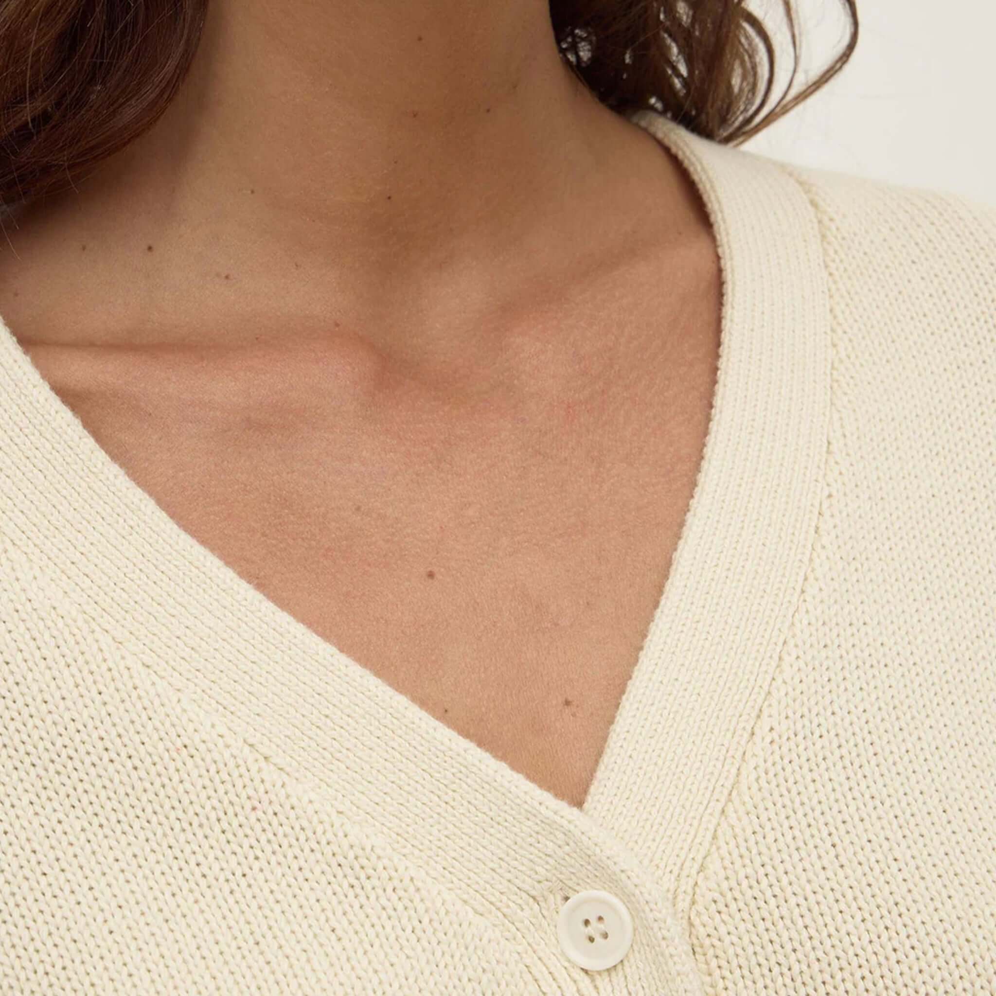 Alt Tag: Assembly Label Meri Cotton Knit Cardigan - Cream V-neck button-front detail in 100% cotton knit