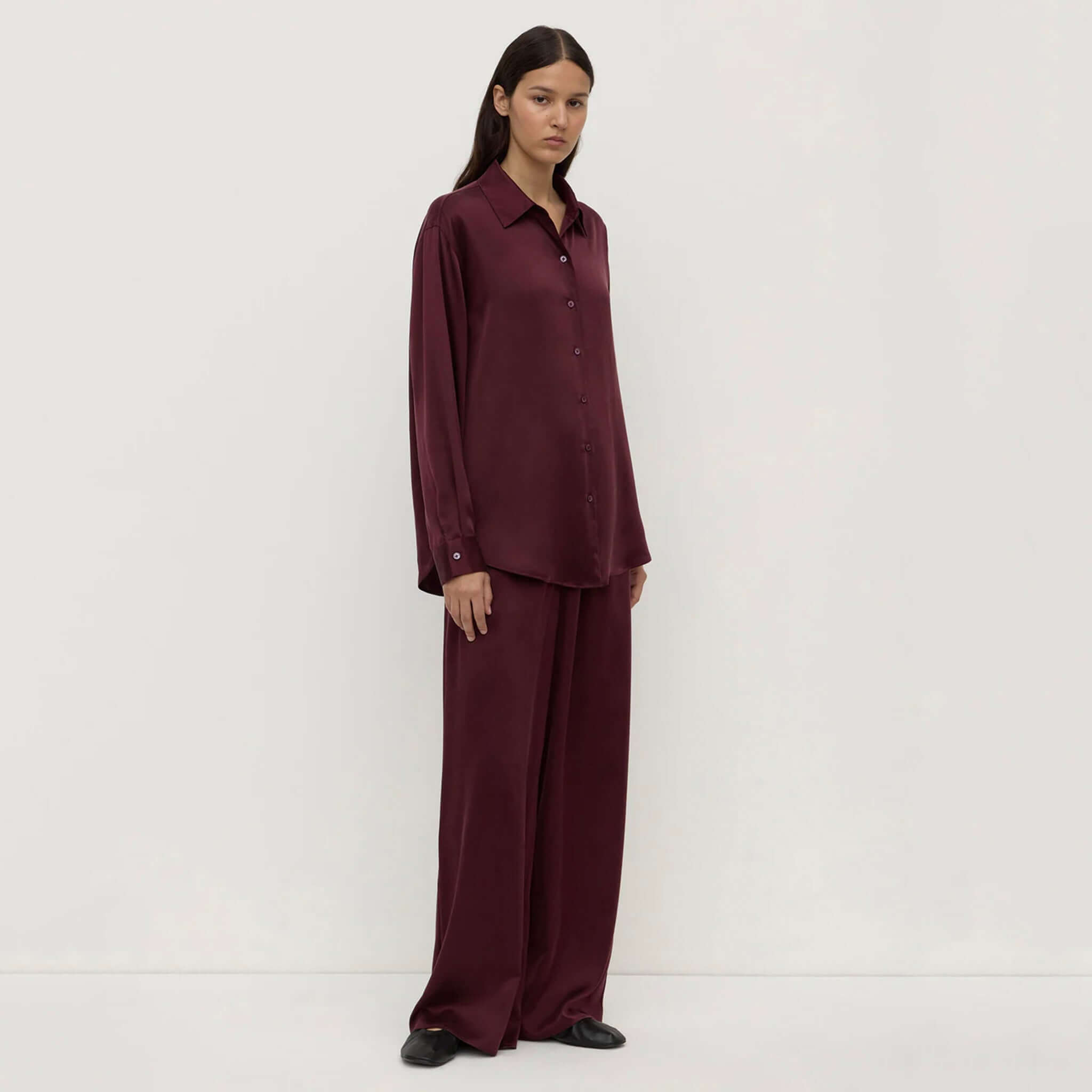 Alt Tag: Assembly Label Pippa Silk Long Sleeve Shirt - Merlot on model, relaxed fit 100% silk shirt with classic collar and buttons