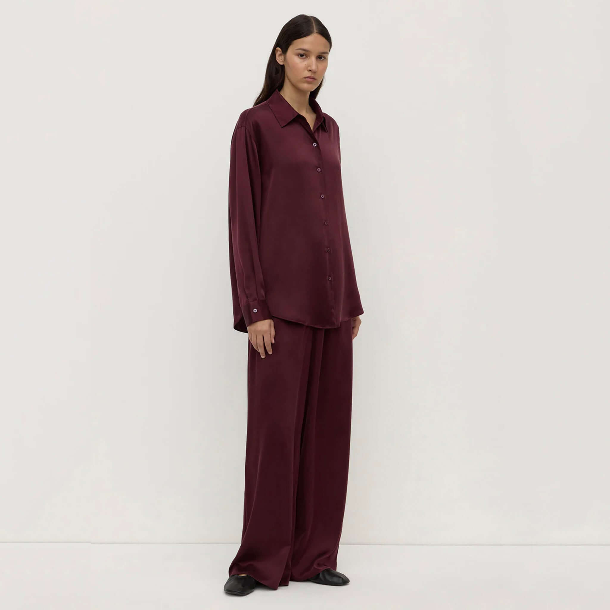 Assembly Label Pippa Silk Long Sleeve Shirt - Merlot on model, relaxed fit 100% silk shirt with classic collar and mother-of-pearl buttons