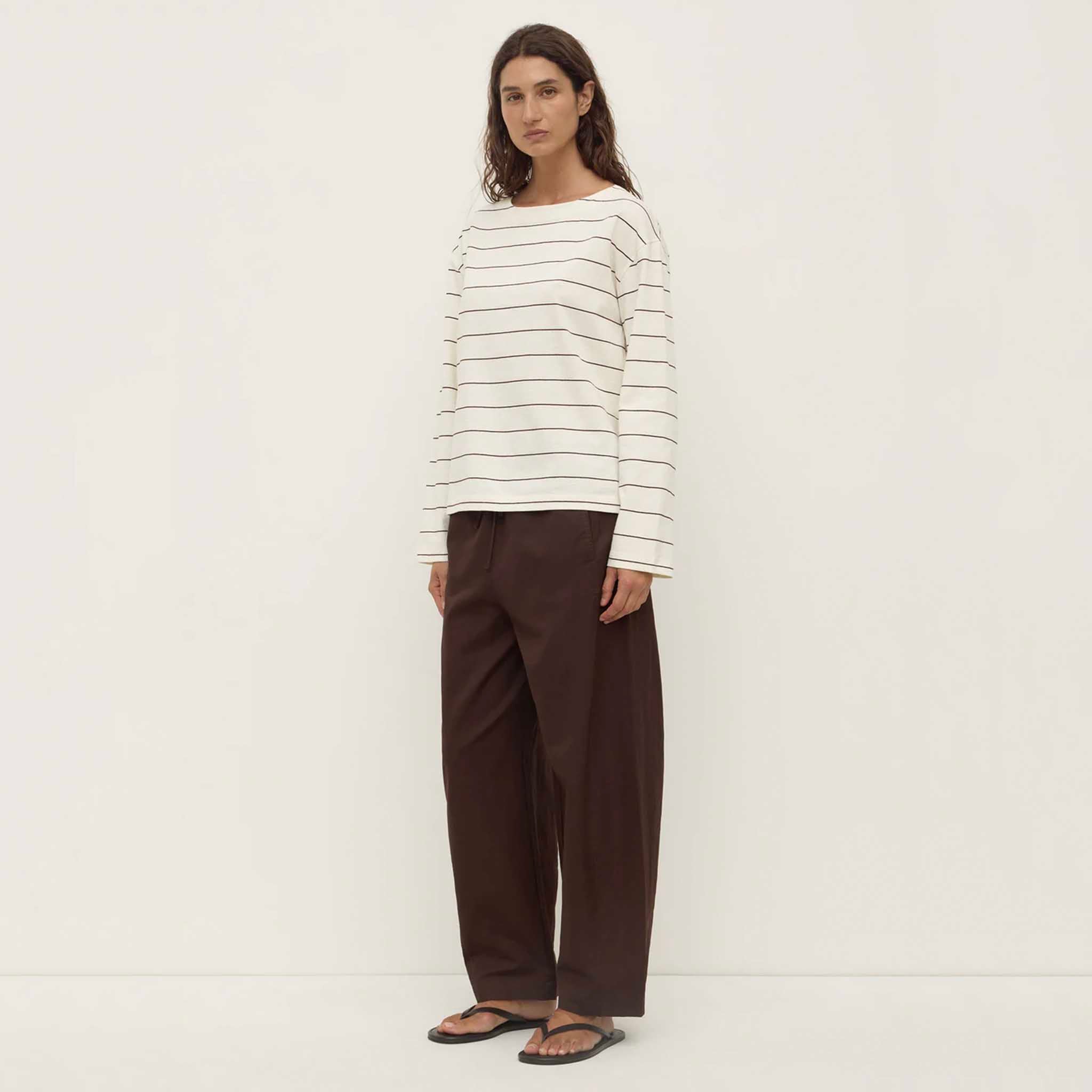 Alt Tag: Assembly Label Scout Long Sleeve Tee - Cream & Mulberry striped boat neck long sleeve top styled with wide-leg pants