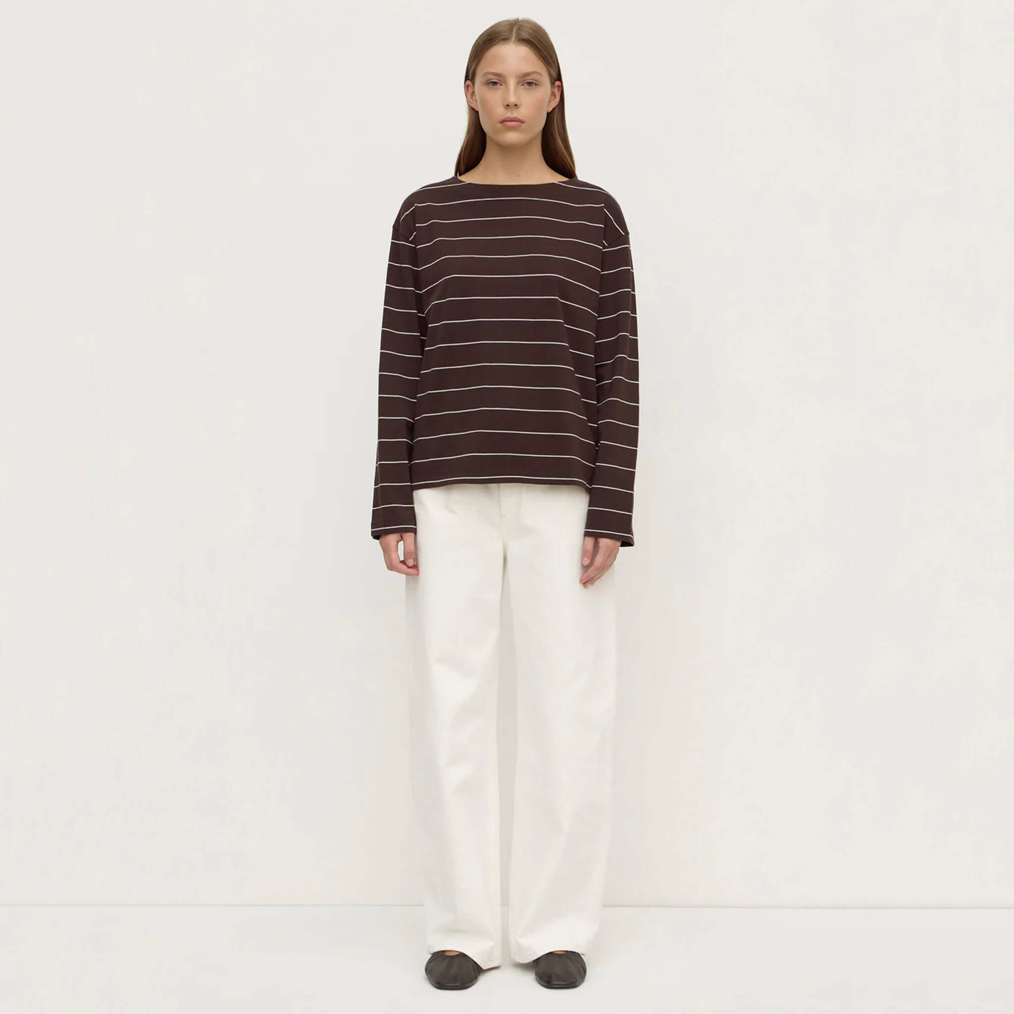 Assembly Label Scout Long Sleeve Tee - Ganache Cream Stripe worn with white pants for a stylish look.
