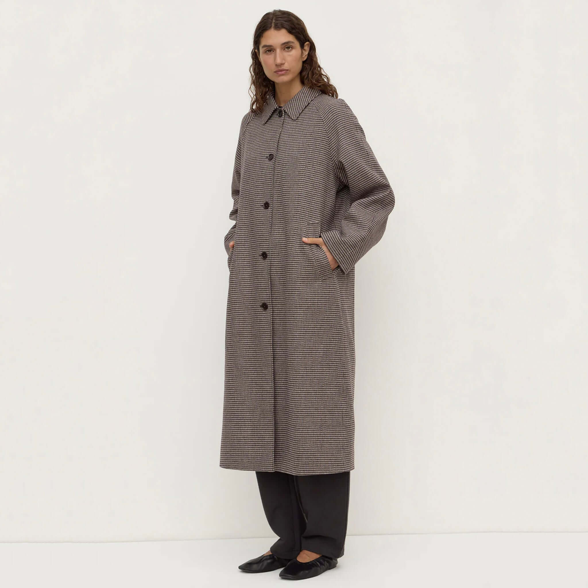 Assembly Label Solana Wool Coat in Brown Black Check with button-front design and side pockets.