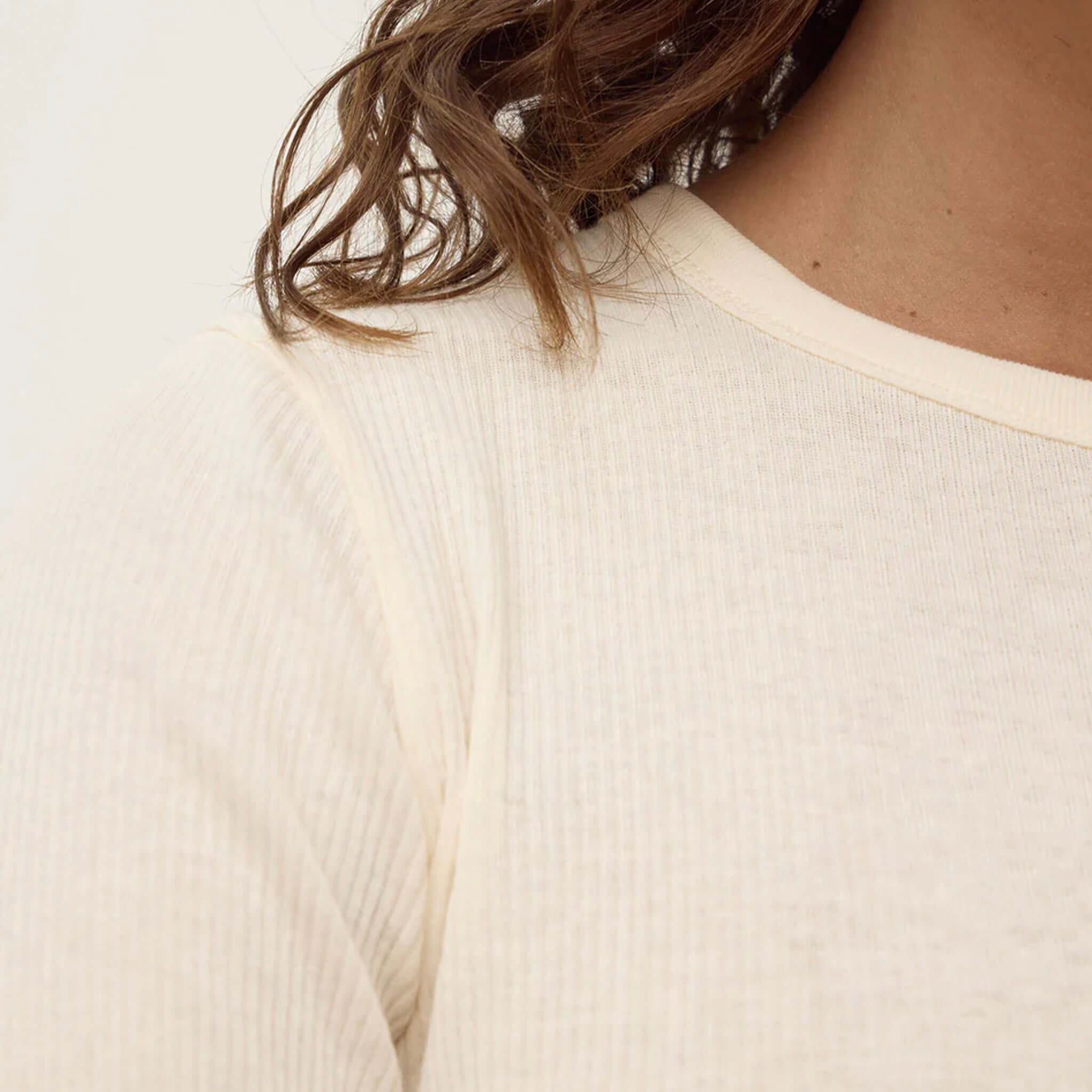 Alt Tag: Assembly Label Zali Long Sleeve Tee - Cream ribbed cotton crew neck top close-up in soft cream