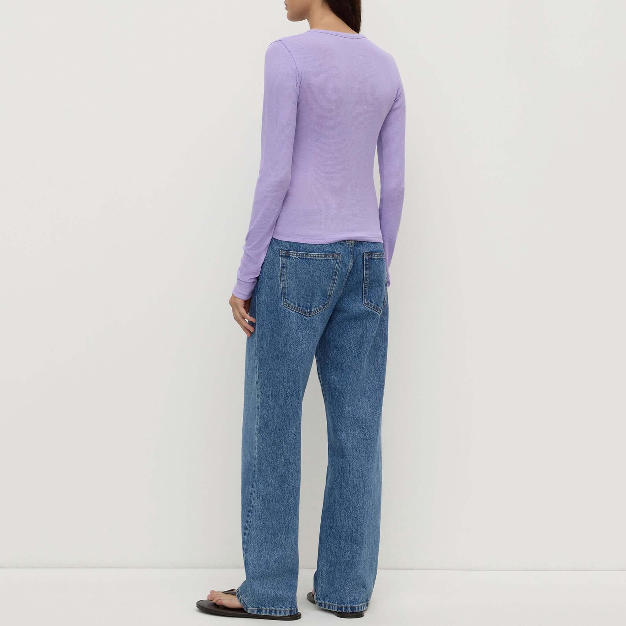 Assembly Label Zali Long Sleeve Tee - Mauve displayed on a model, showcasing the back view with blue jeans.