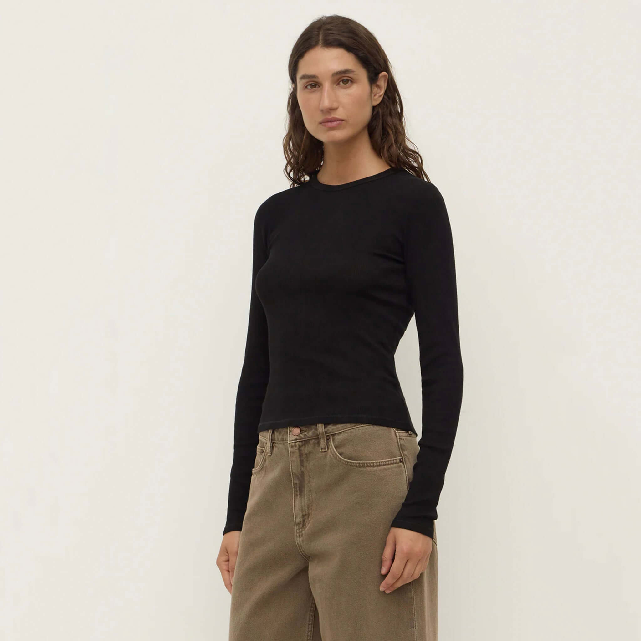 Alt Tag: Assembly Label Zali Long Sleeve Tee - Black ribbed fitted 100% cotton long sleeve tee on model, minimalist layering staple