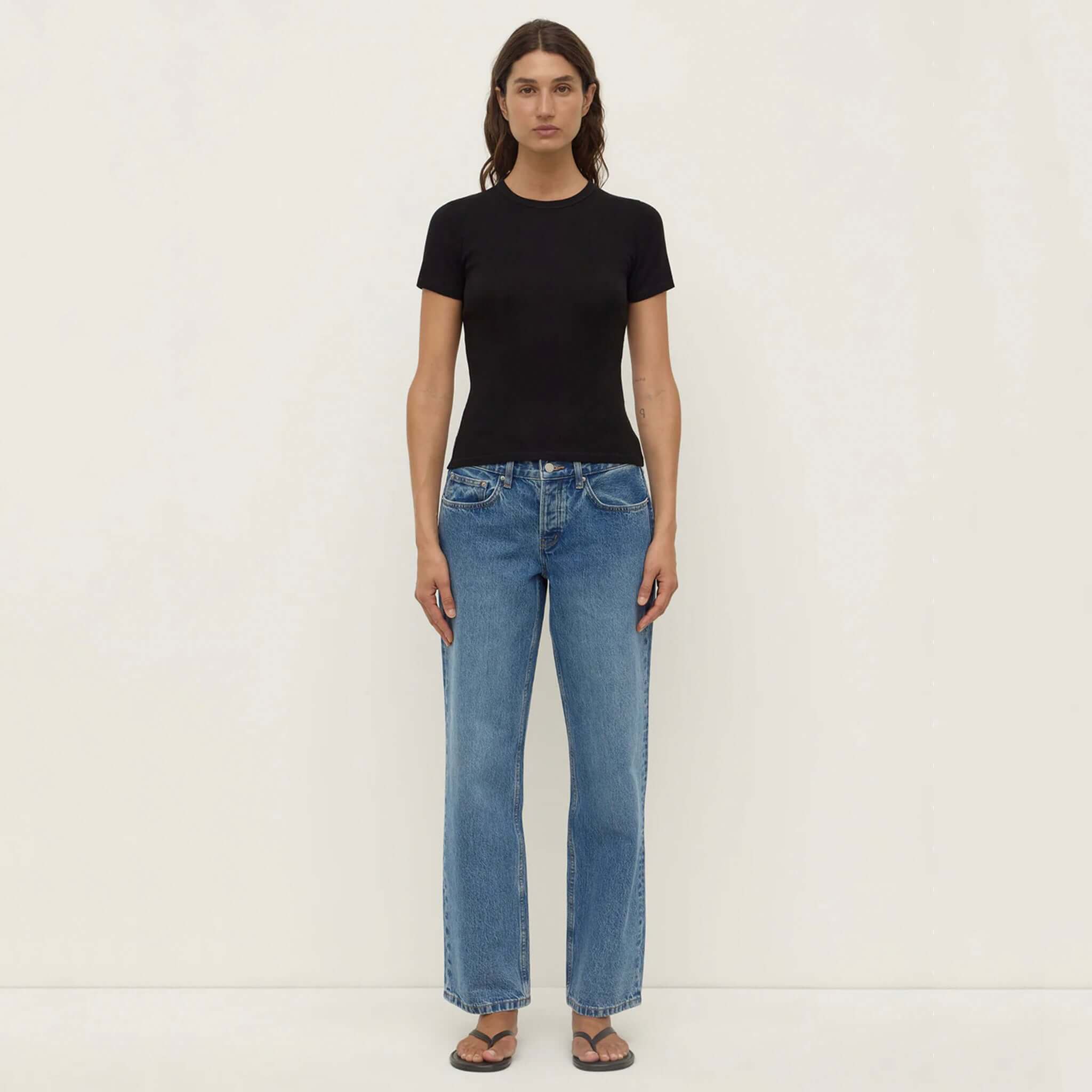 Alt Tag: Assembly Label Zali Short Sleeve Tee - Black ribbed fitted cotton crew neck tee worn with blue jeans