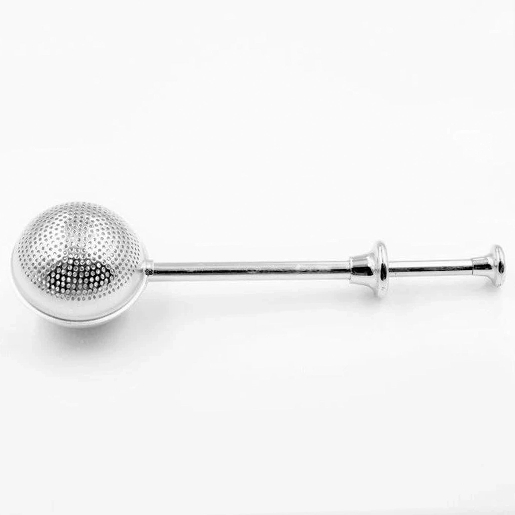 Metallic tea ball on a white background