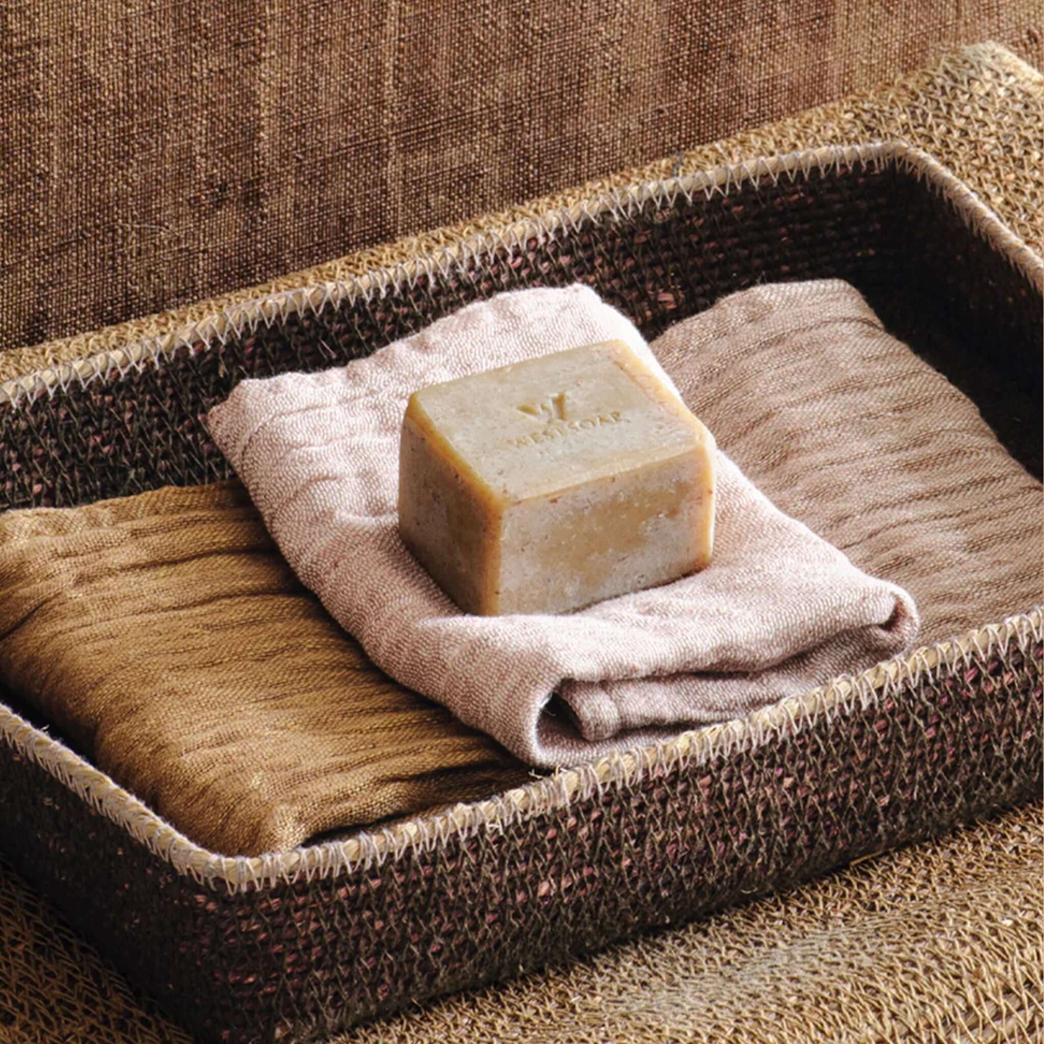 Bianca Lorenne Basso Basket - Medium Cacao woven seagrass tray holding folded linen and soap, stylish organiser for bathroom or entryway
