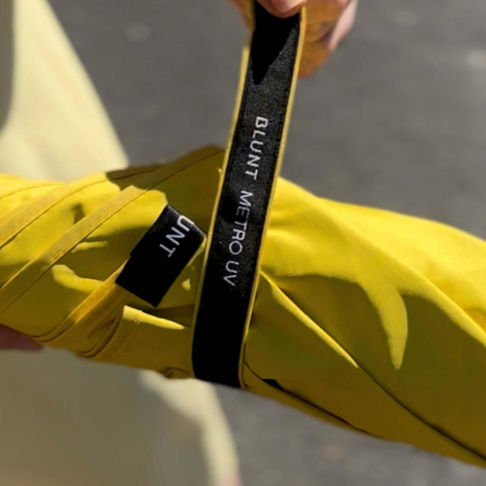 Yellow jacket with a black label on a blurred background